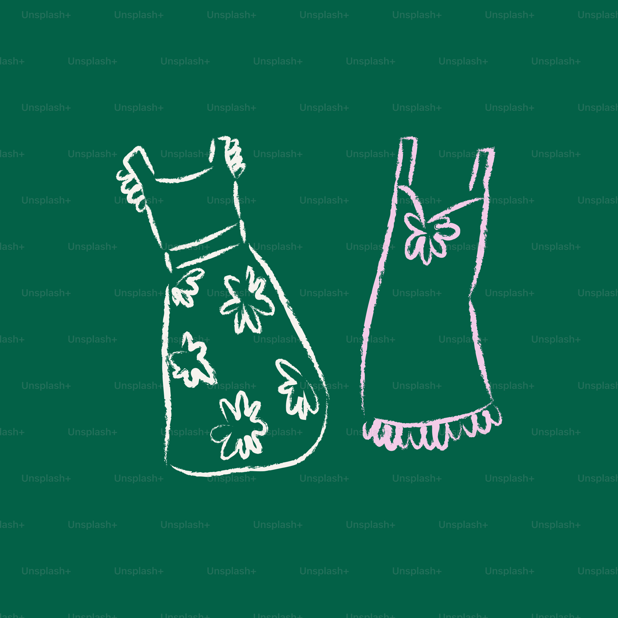 Two dresses drawn with chalk on a green background