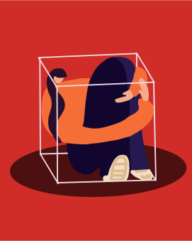 Une personne assise dans une boîte en verre