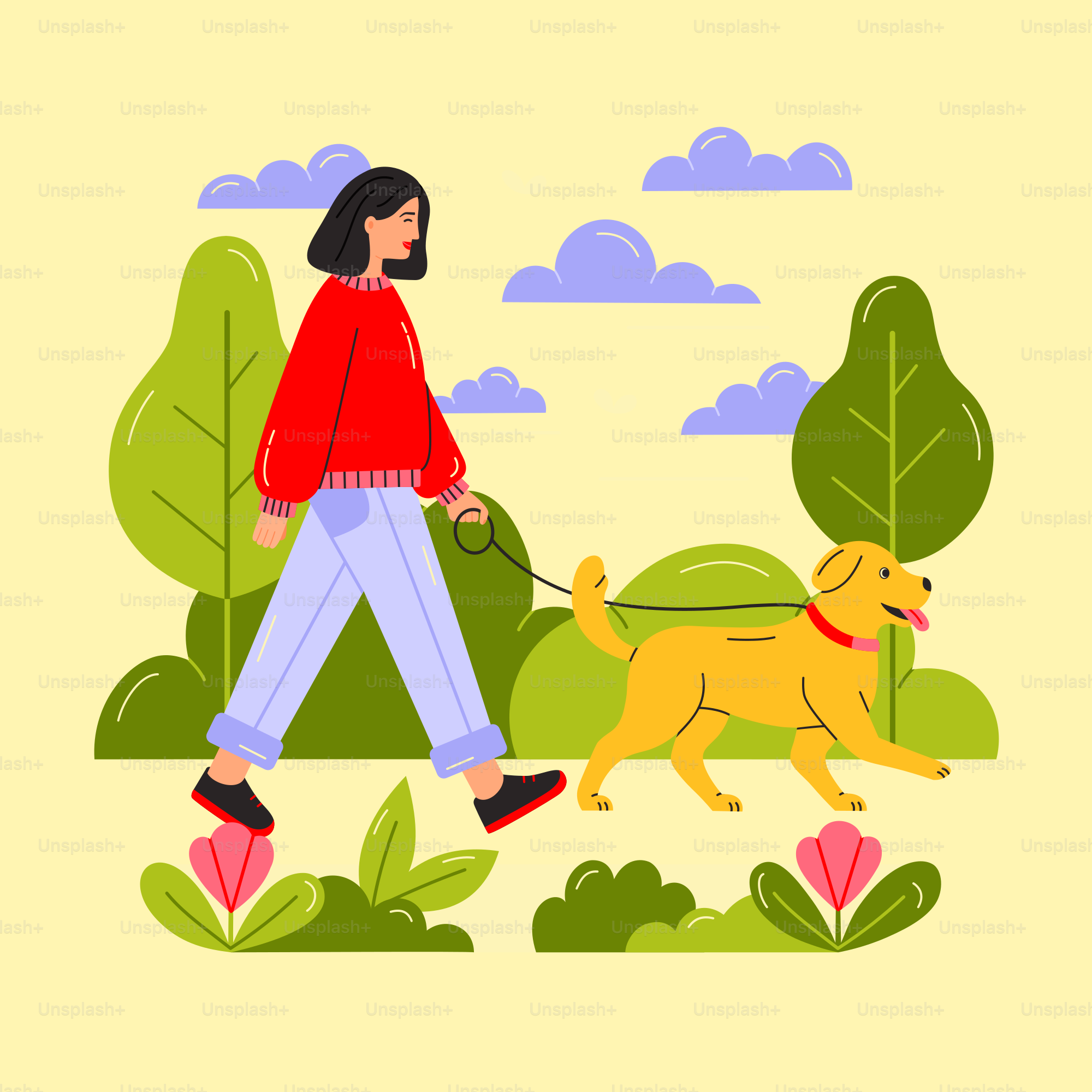 Woman walking a golden dog in a park