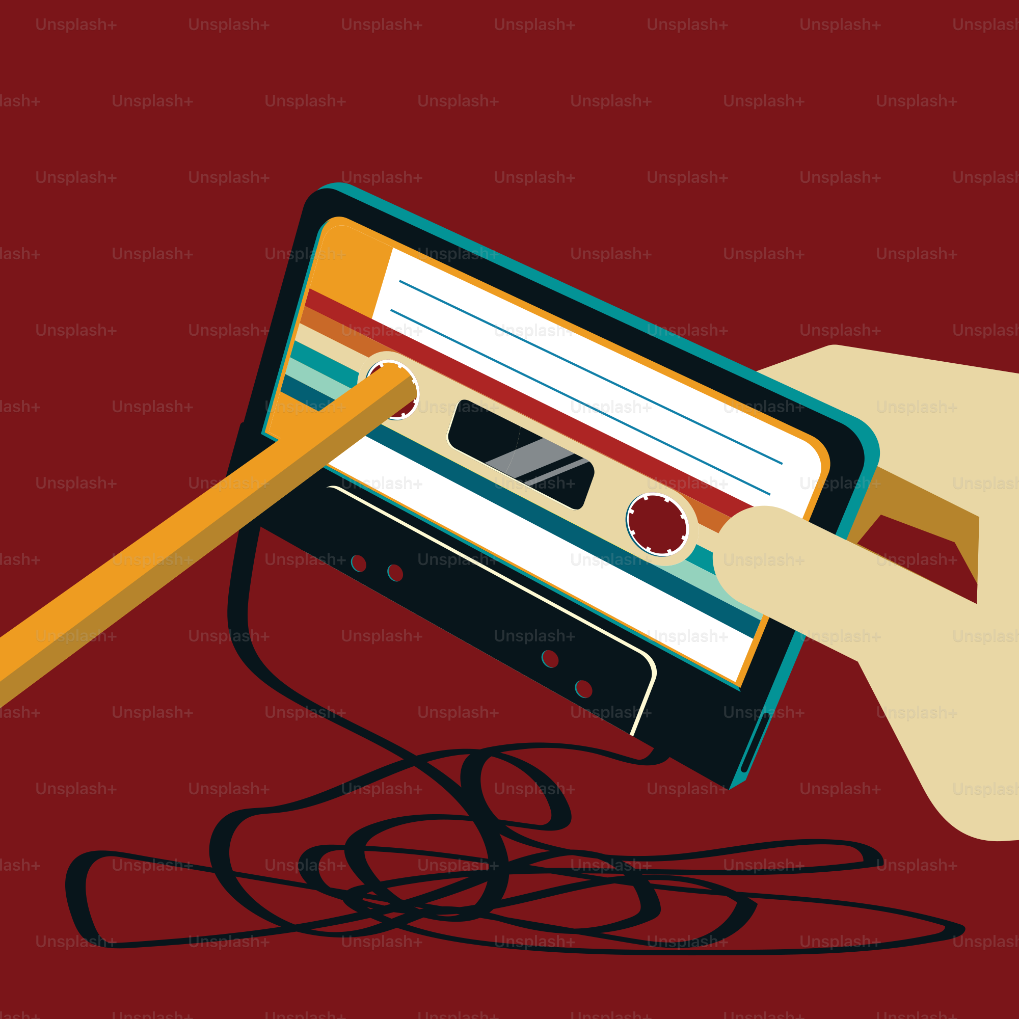 a hand holding a pencil over a cassette player