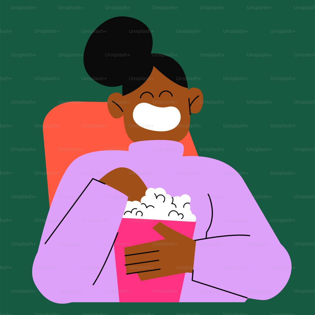 seorang wanita duduk di kursi dengan kotak popcorn