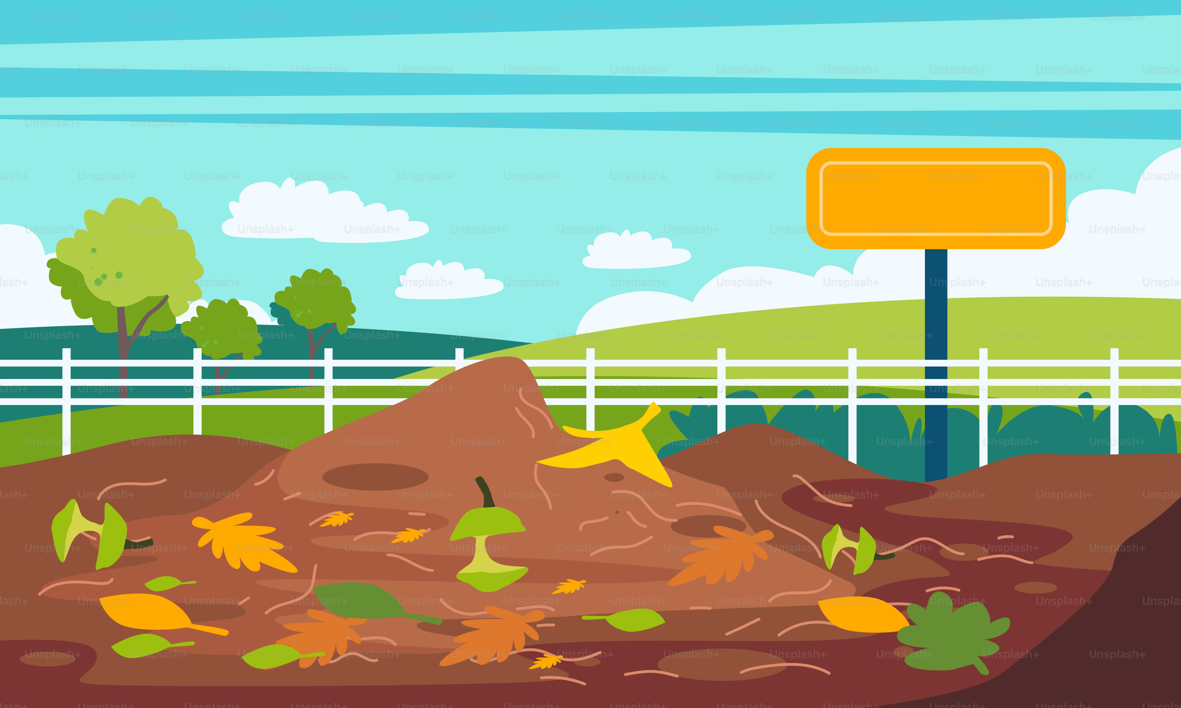 A pile of dirt in front of a fence