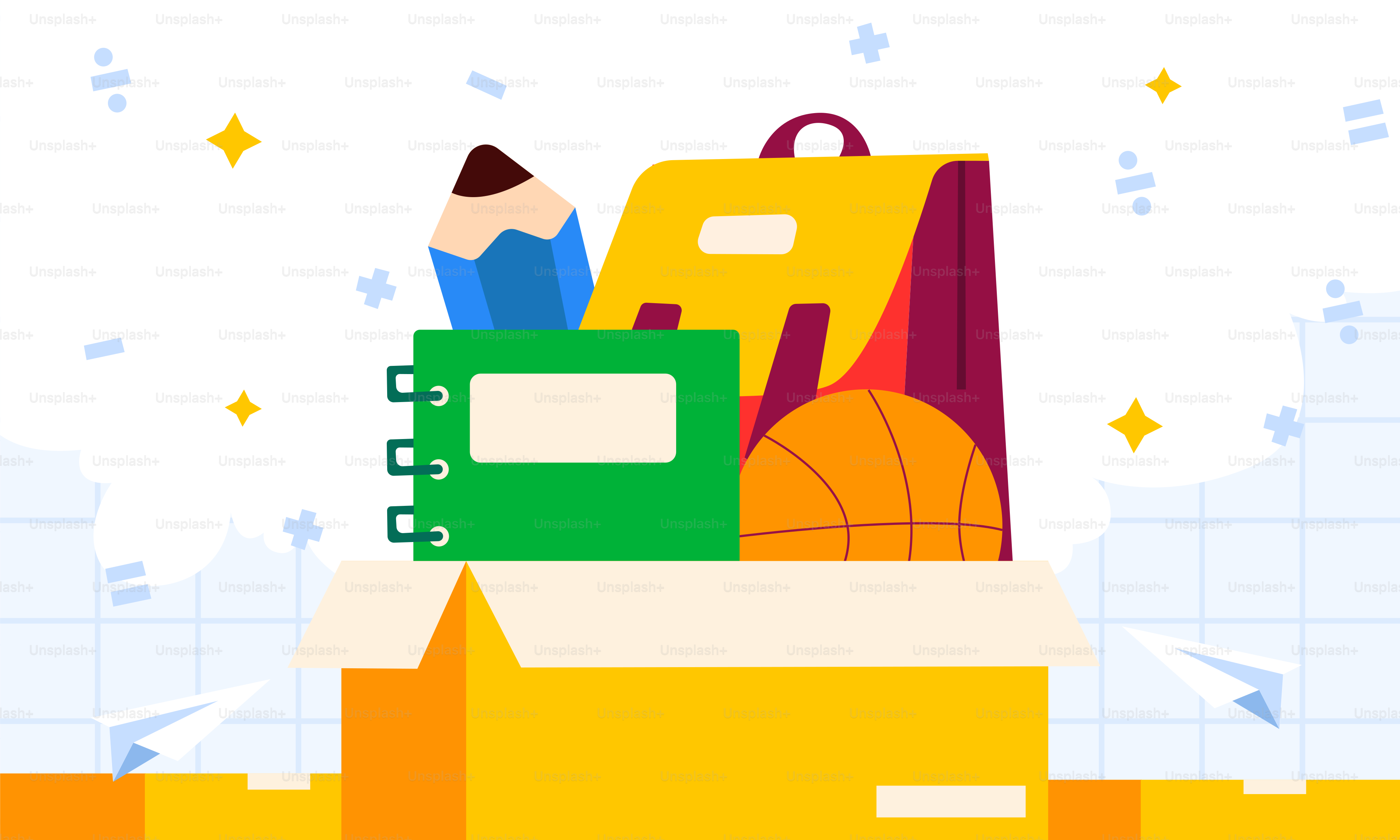 Un montón de material escolar encima de una caja amarilla