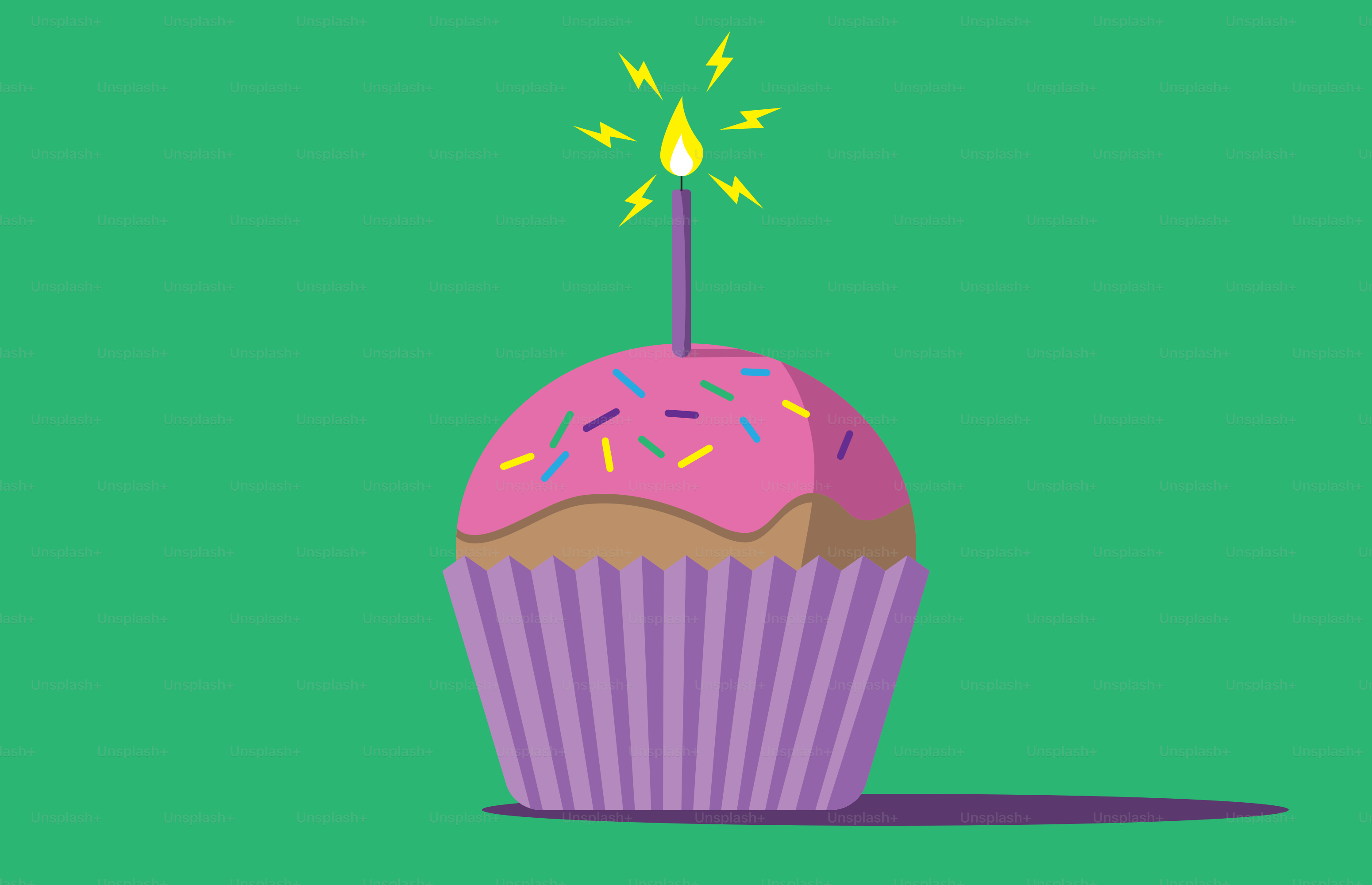 A cupcake with a lit candle on top of it