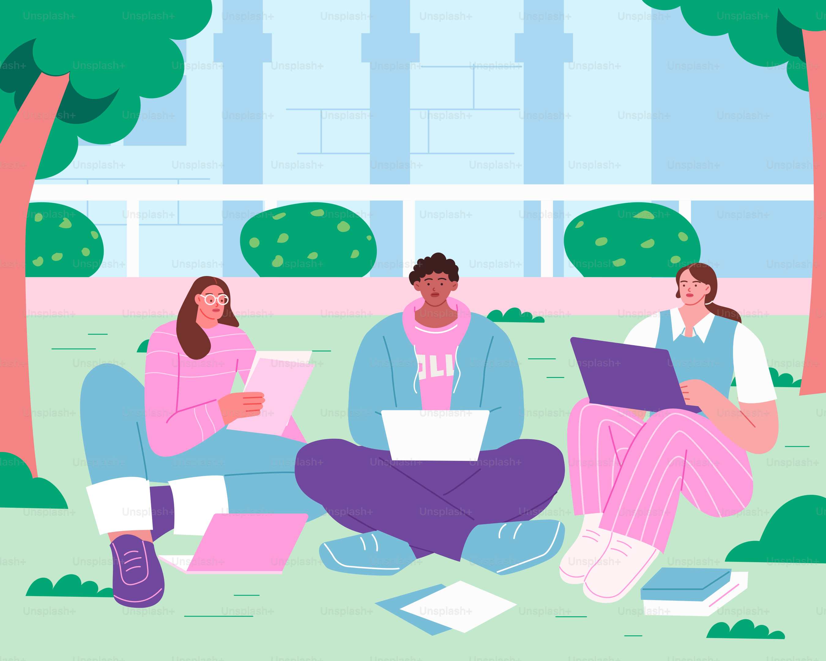 A group of people sitting on the ground with laptops