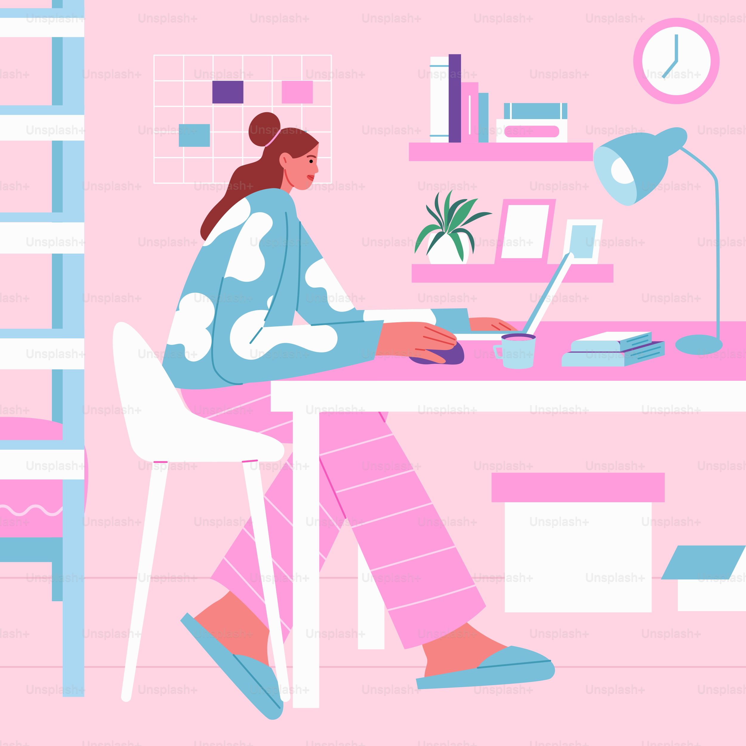 A woman sitting at a desk working on a laptop