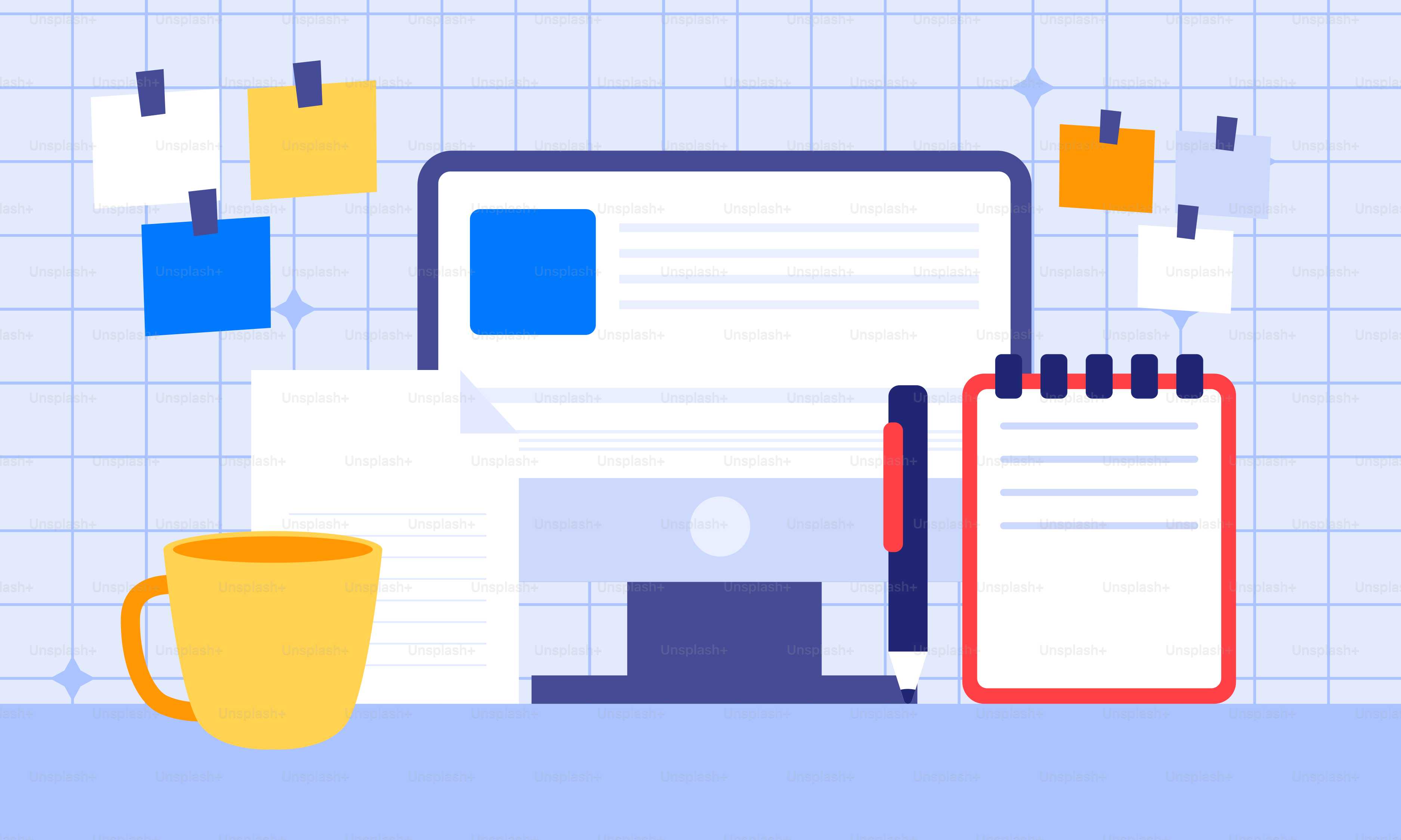 カップとコンピューターのある机