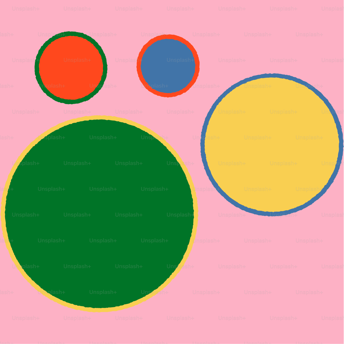 A picture of three circles on a pink background