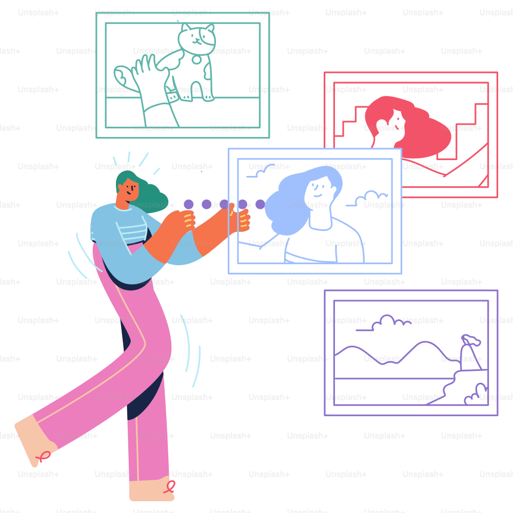 A man is walking through a room with pictures on the wall