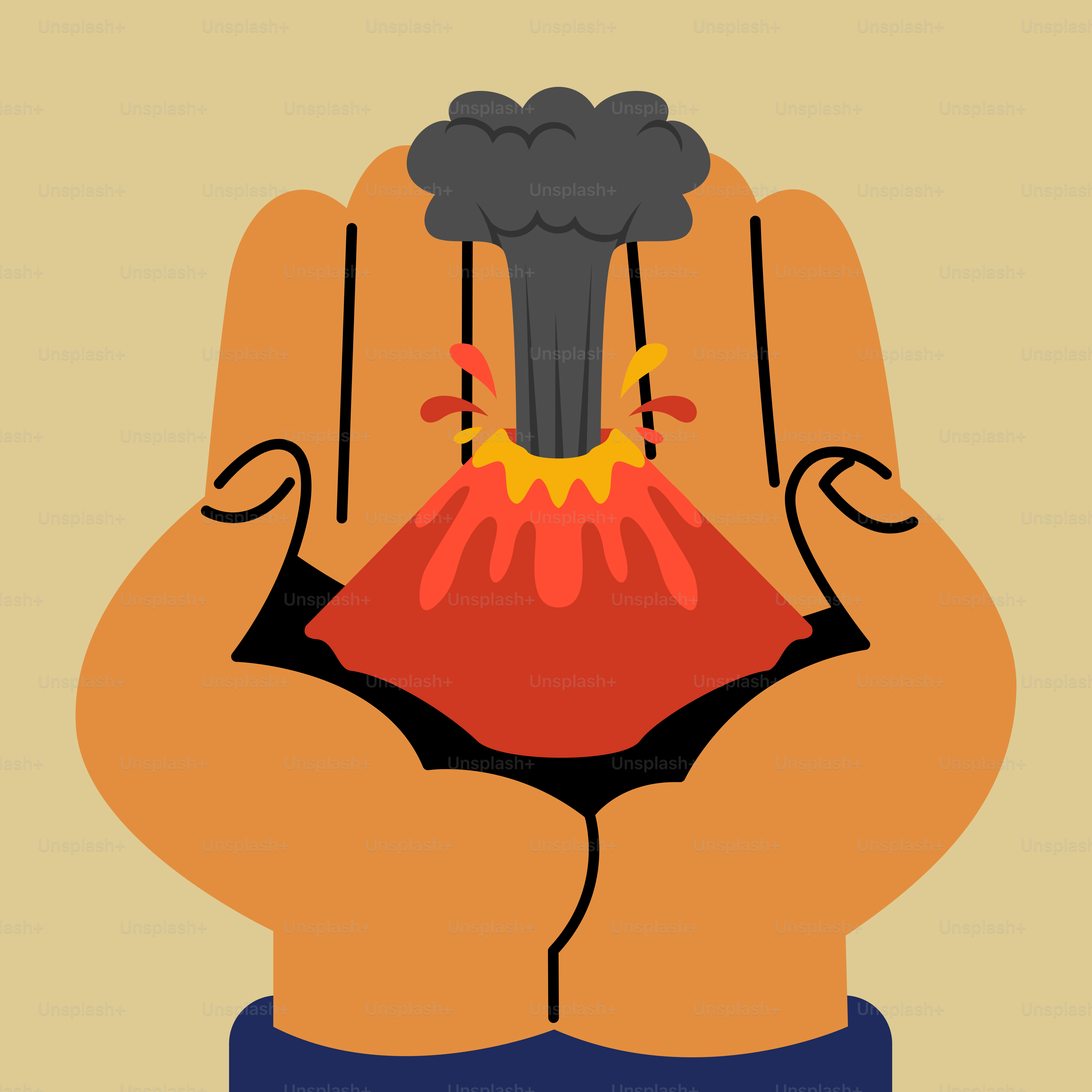 A hand holding a black object with a red volcano on it