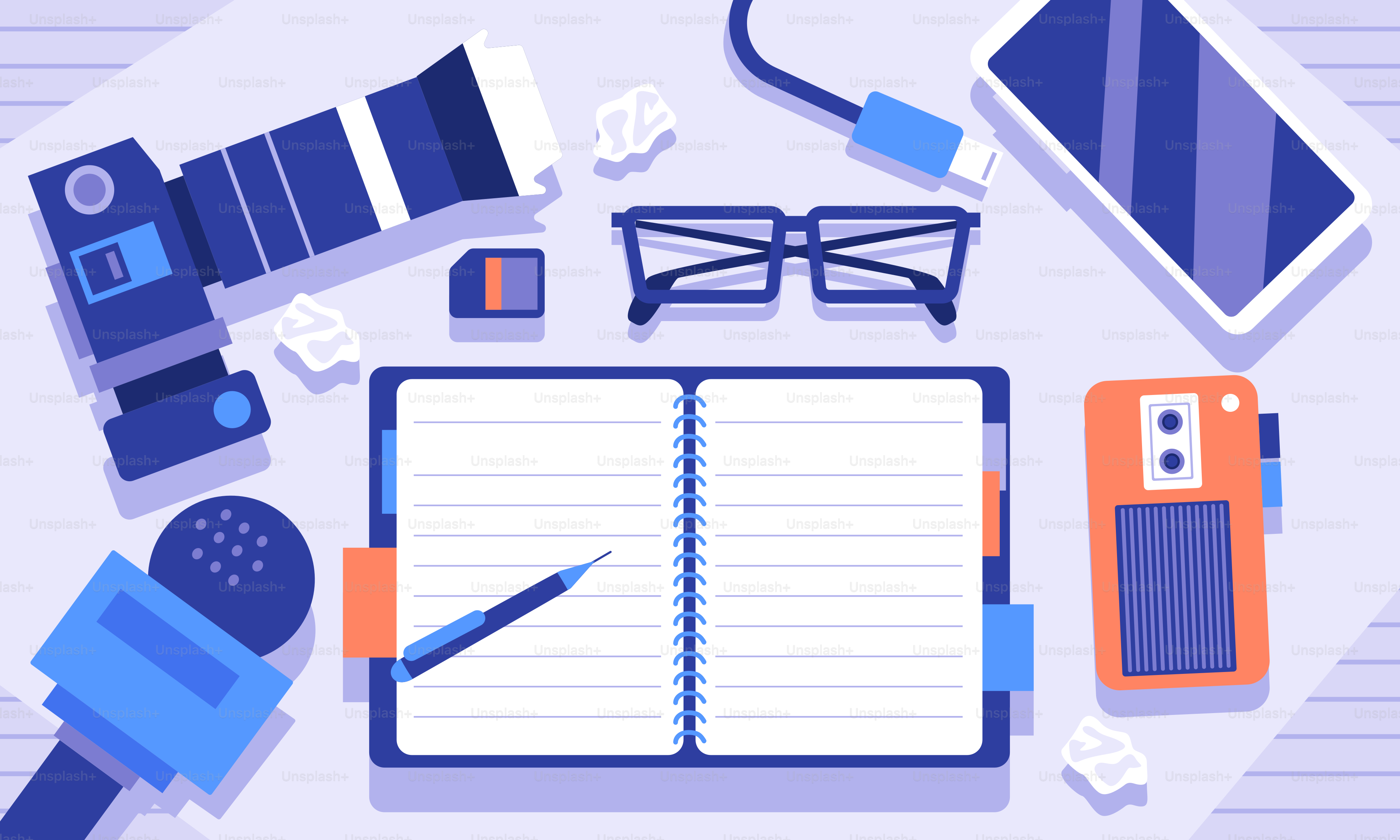 An open notebook surrounded by office supplies