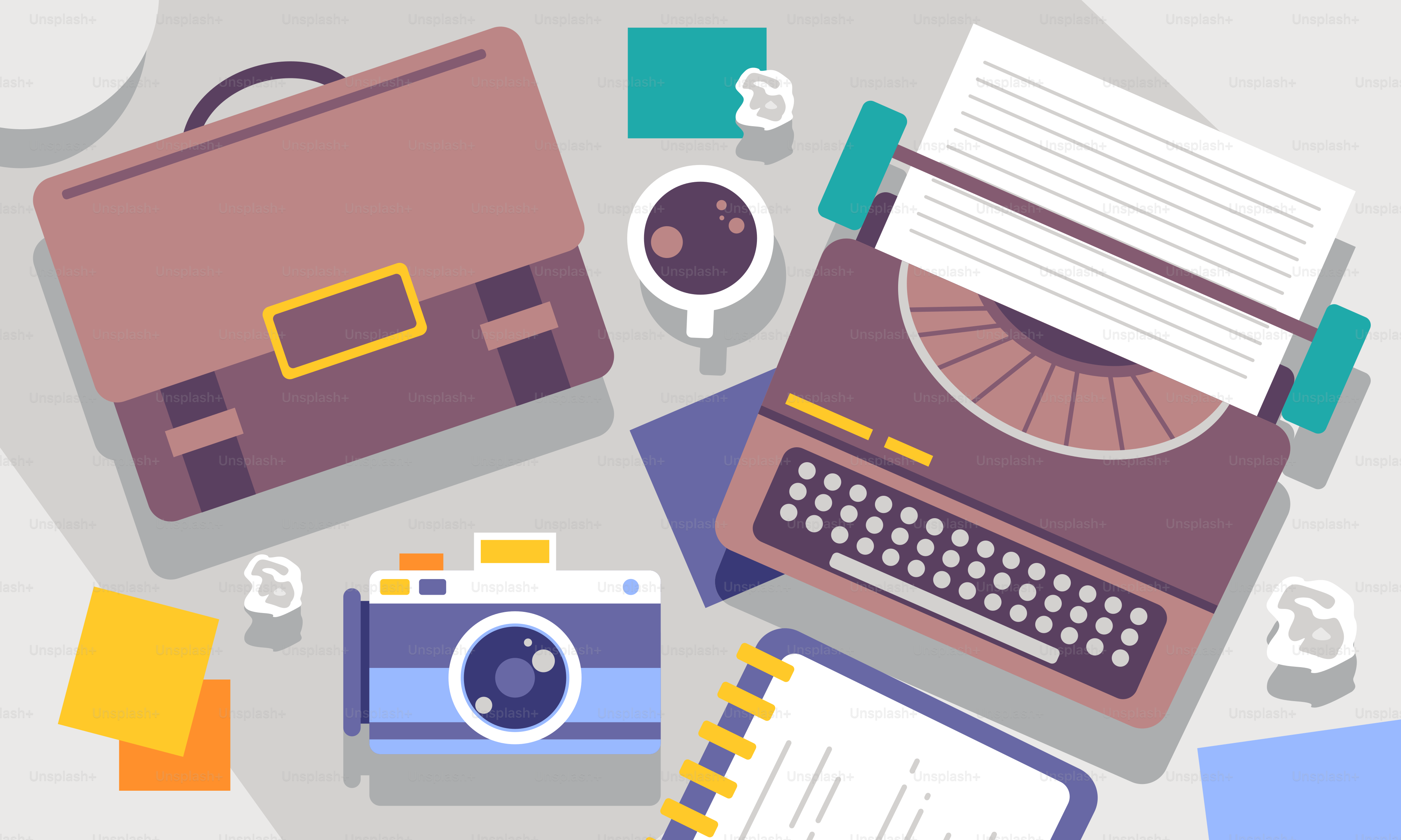 A table topped with a laptop computer next to a typewriter