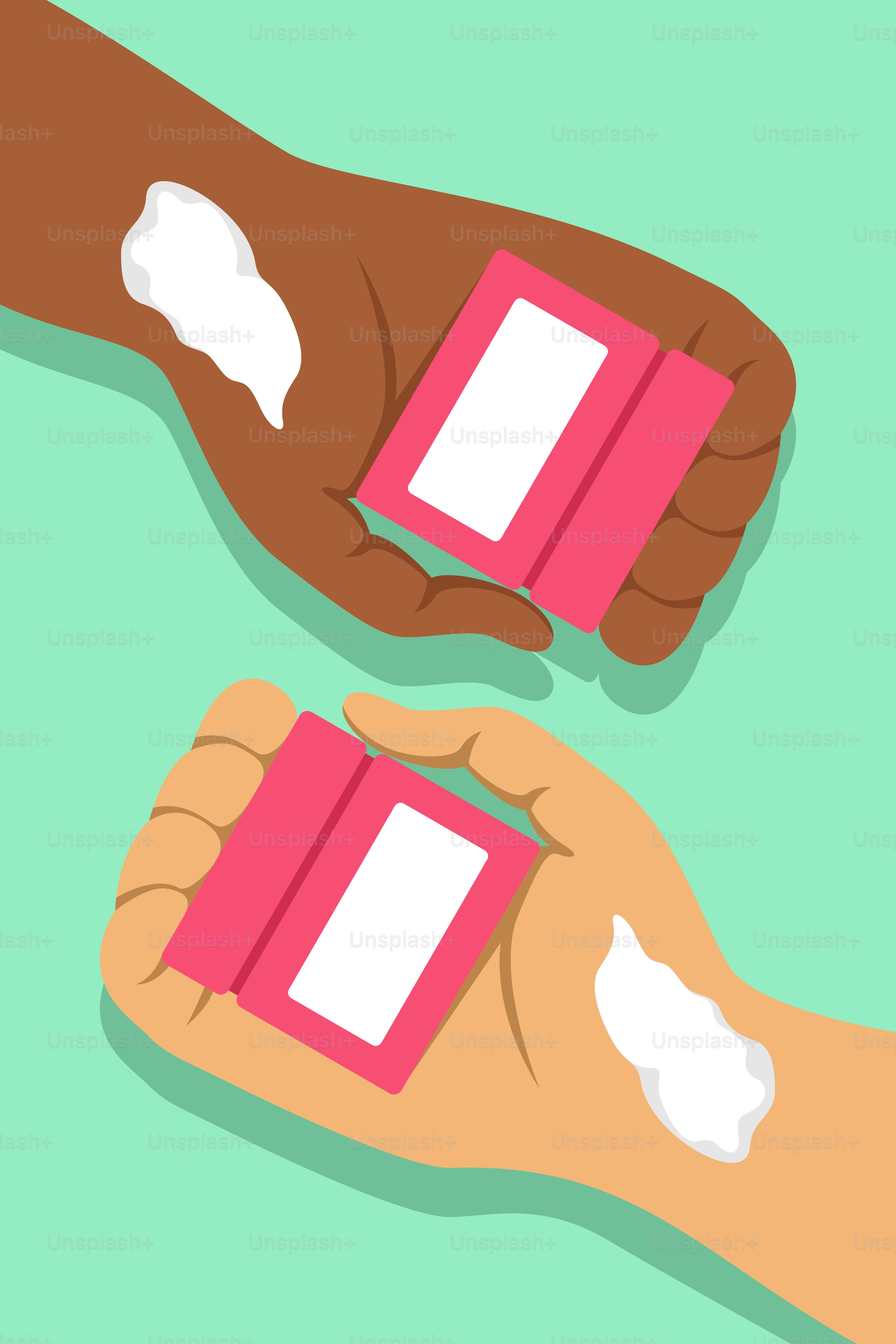 A pair of hands holding two pieces of pink paper