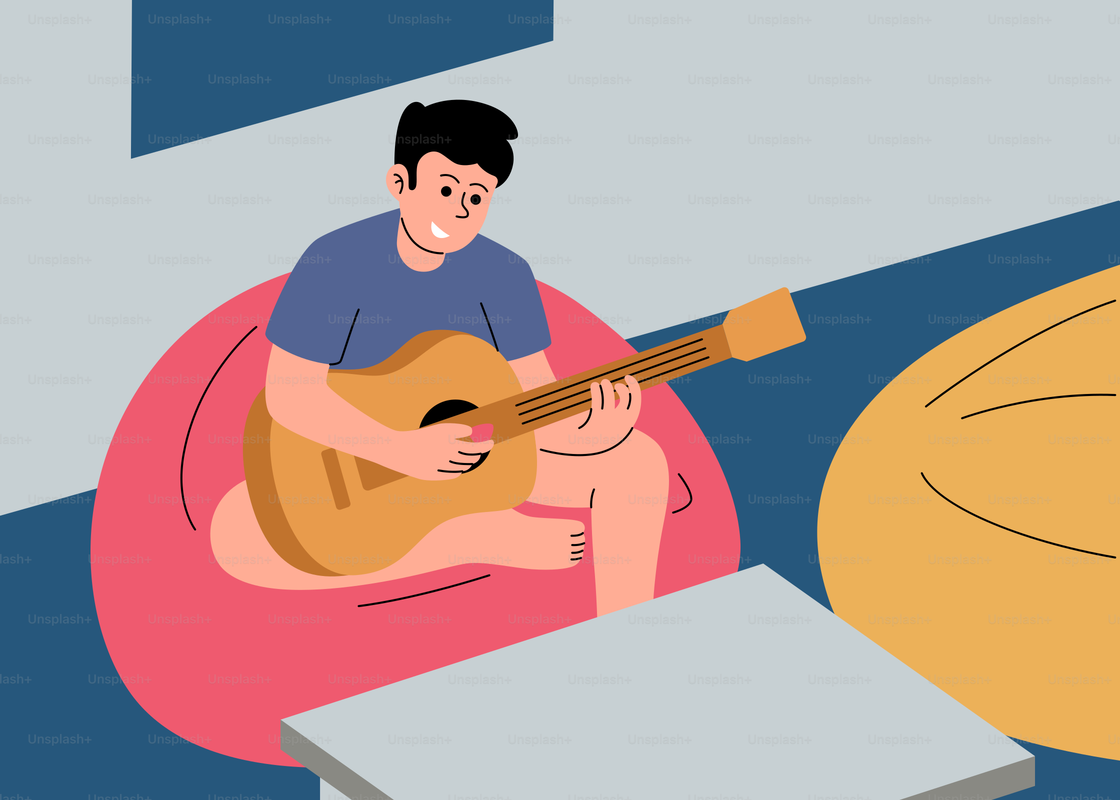 Ein Mann, der auf einem Sitzsack sitzt und Gitarre spielt
