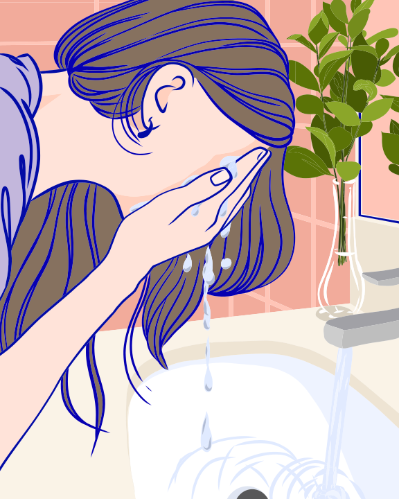 A woman taking a bath in a sink