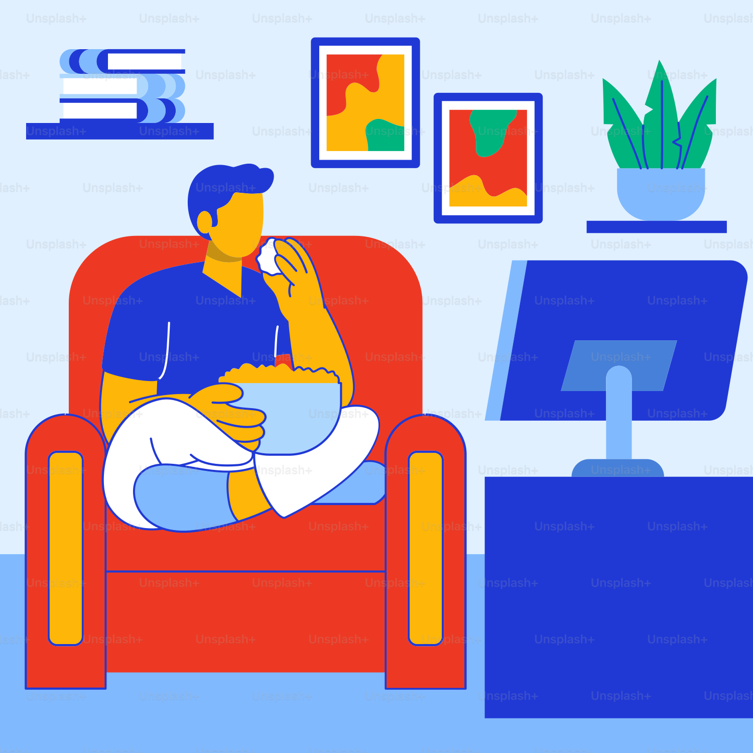 A man sitting on a red chair in front of a computer