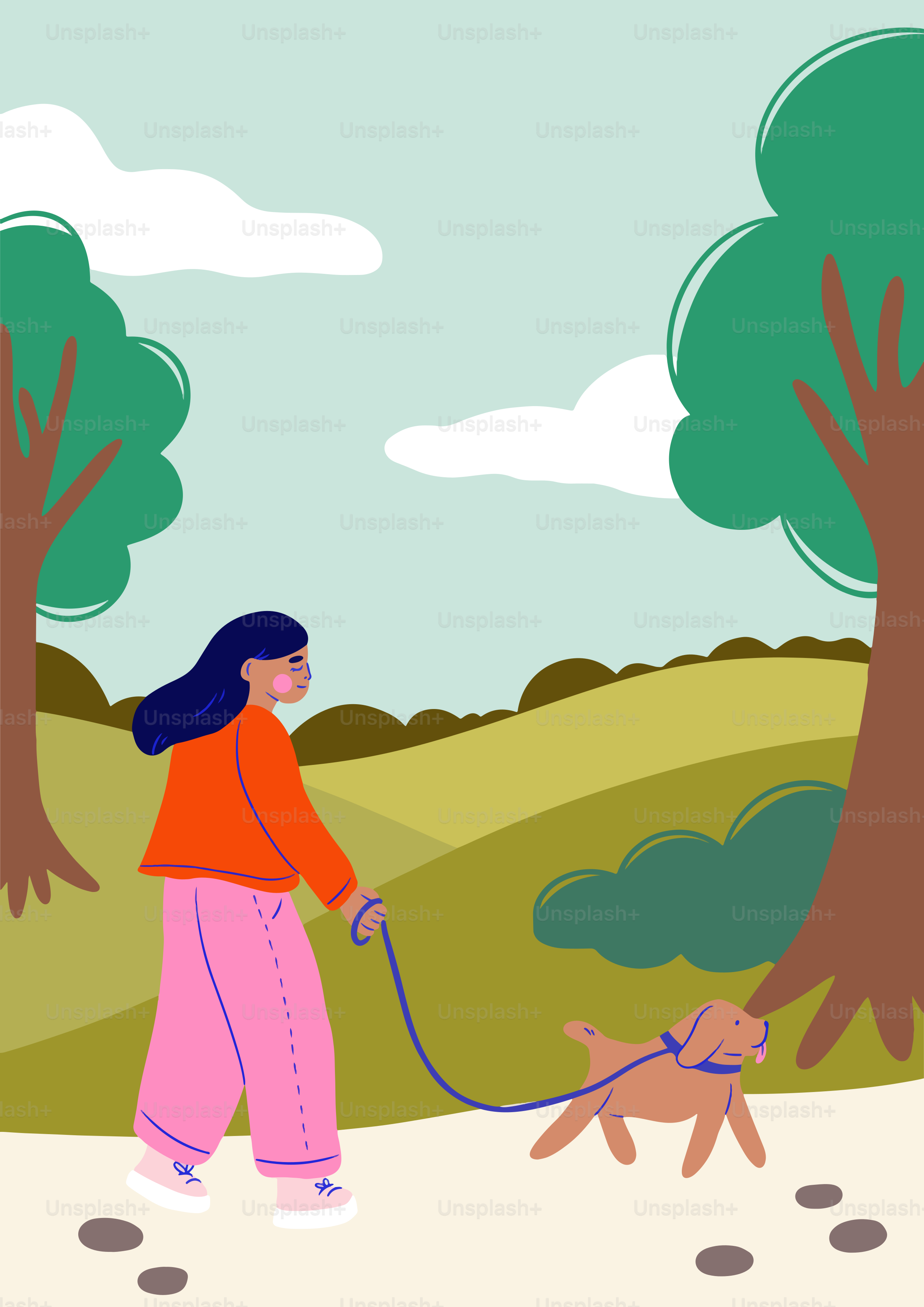 A woman walking a dog in a park
