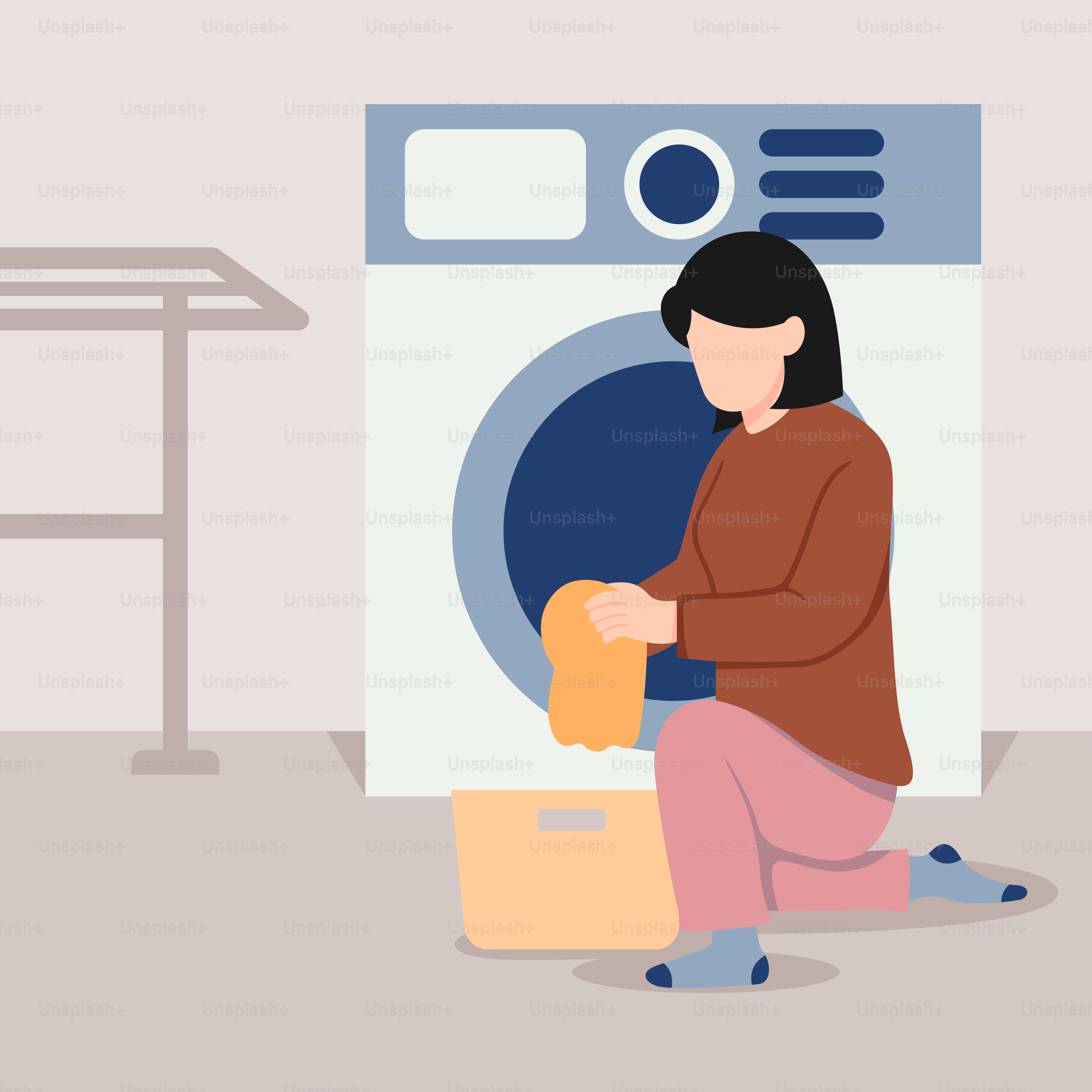 A woman is sitting in front of a washing machine