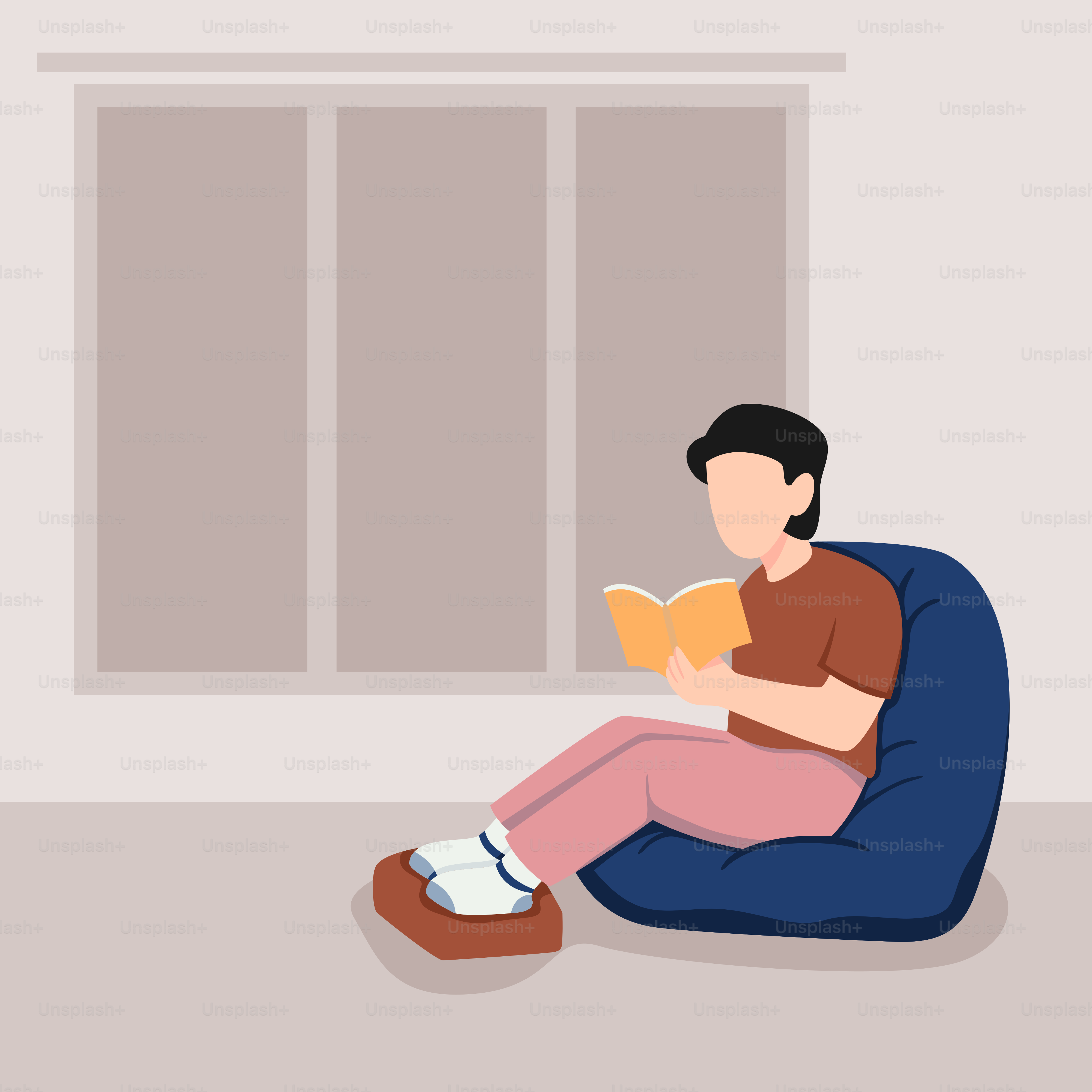 A man sitting on a bean bag chair reading a book