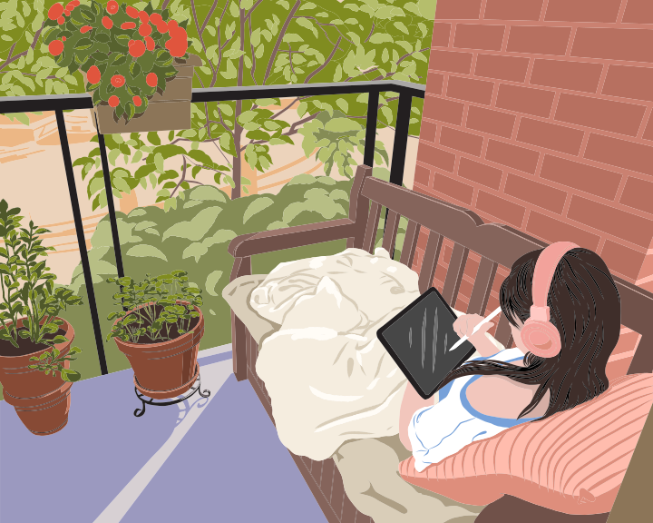 A woman laying on a porch with a laptop