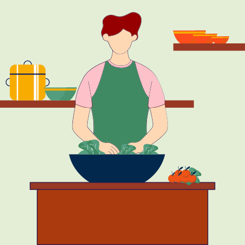 A person in a kitchen preparing food on a counter