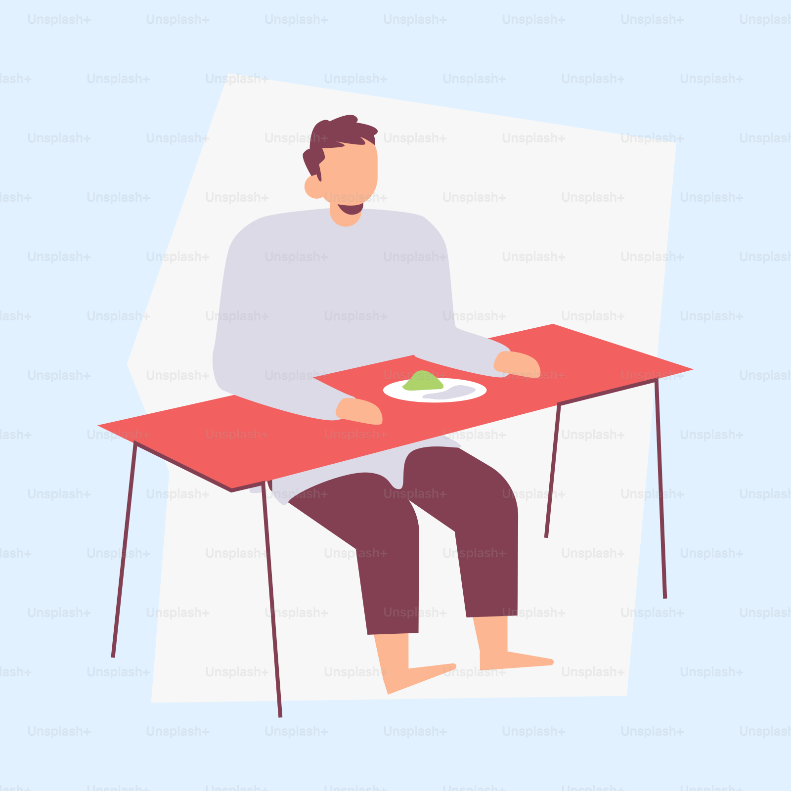 A man sitting at a table with a plate of food