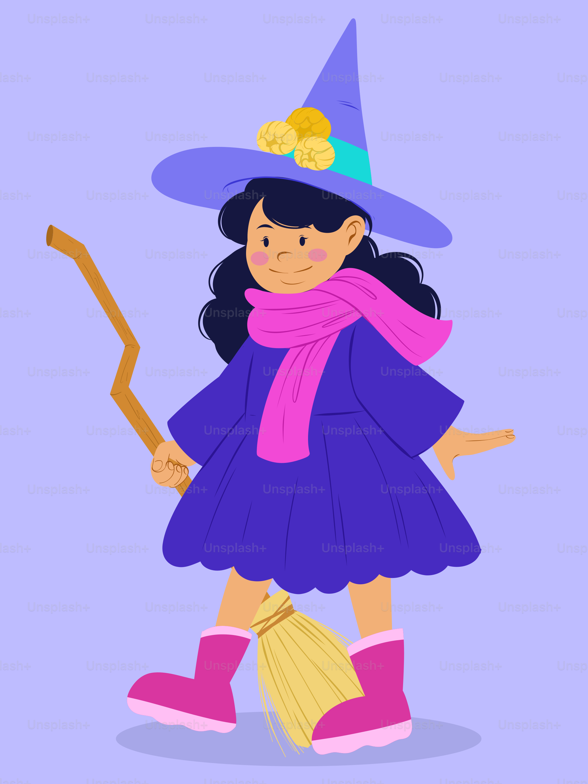 A little girl dressed as a witch with a broom