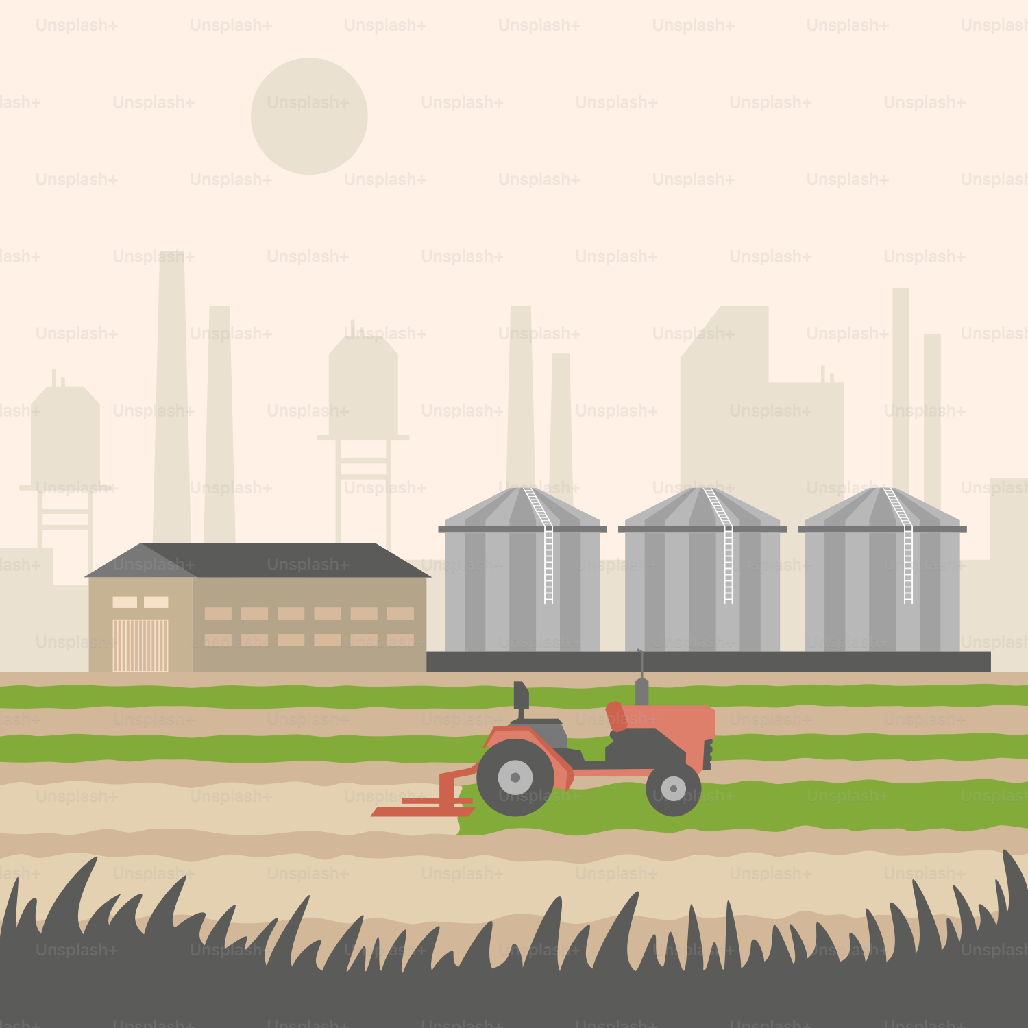 A tractor is plowing a field in front of a factory