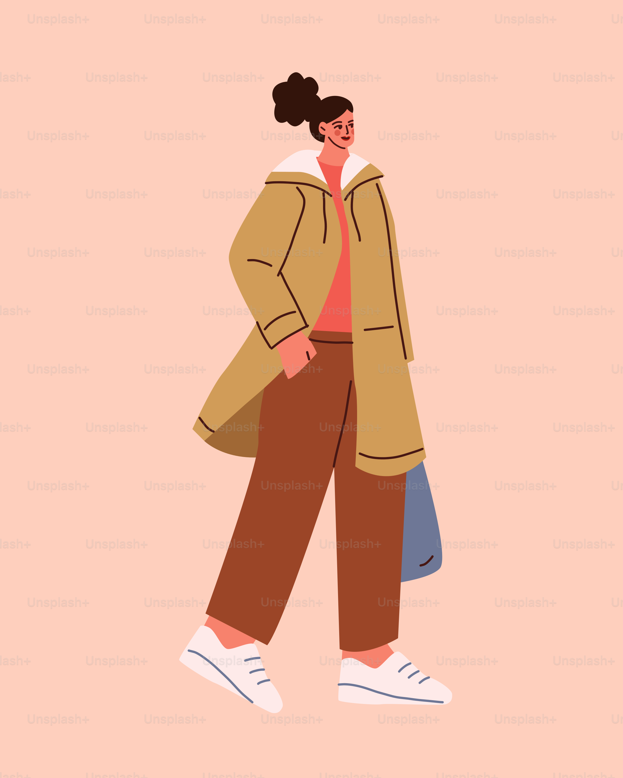 A woman walking down a street wearing a coat