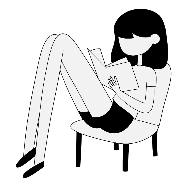 A woman sitting in a chair reading a book