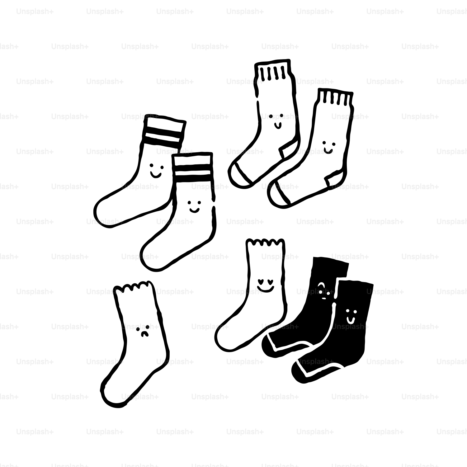 Four pairs of socks with faces drawn on them