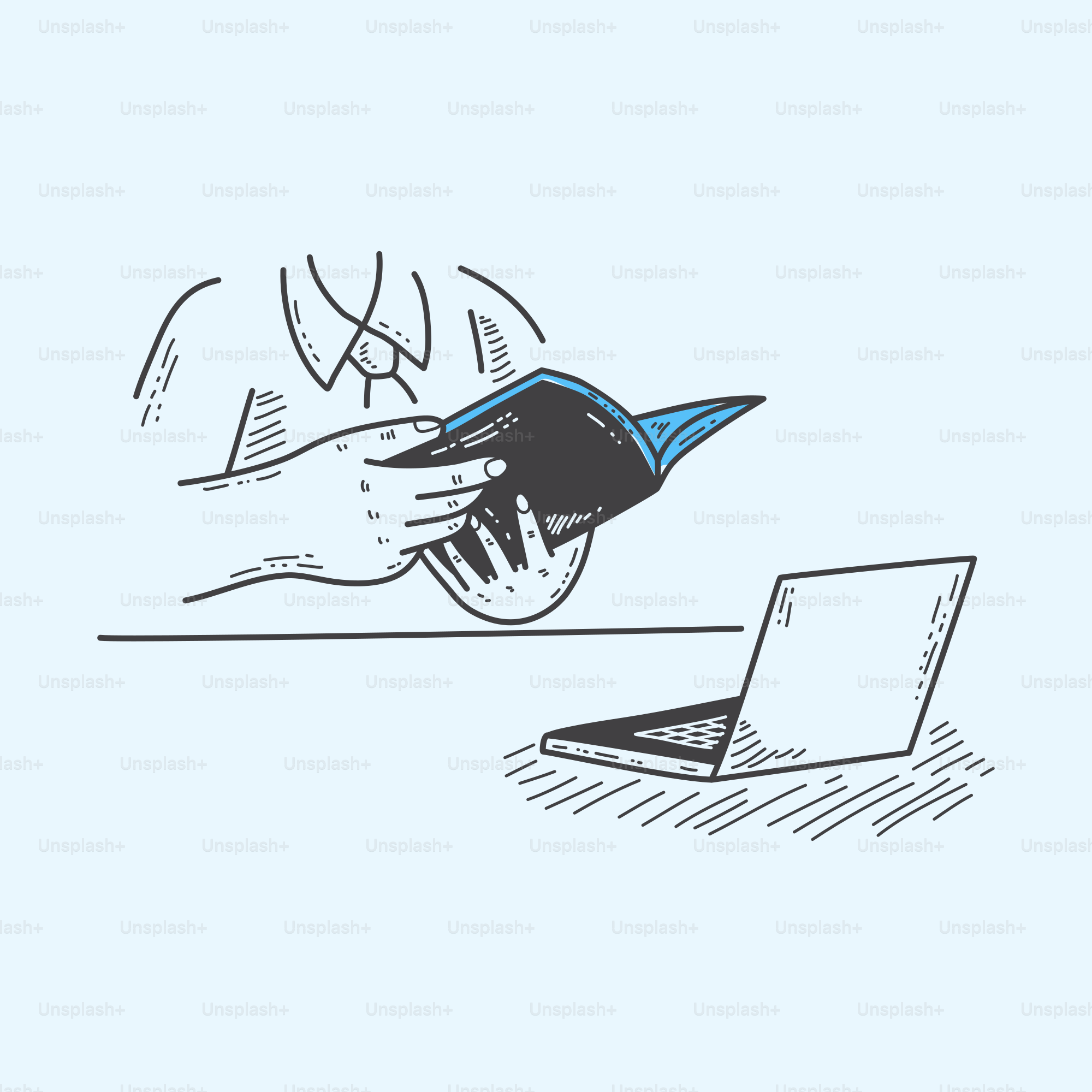 A hand is holding a credit card over a laptop