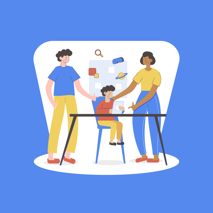 A group of people standing around a table