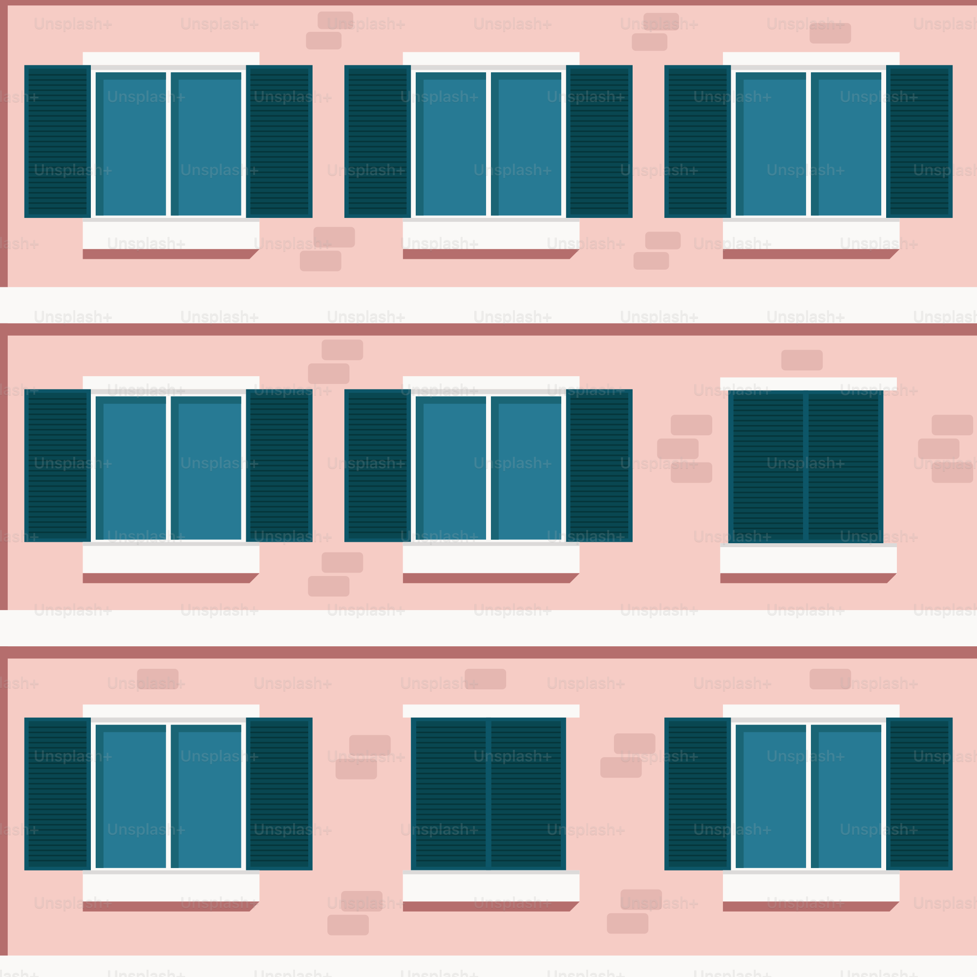 A pink building with four windows and a red door