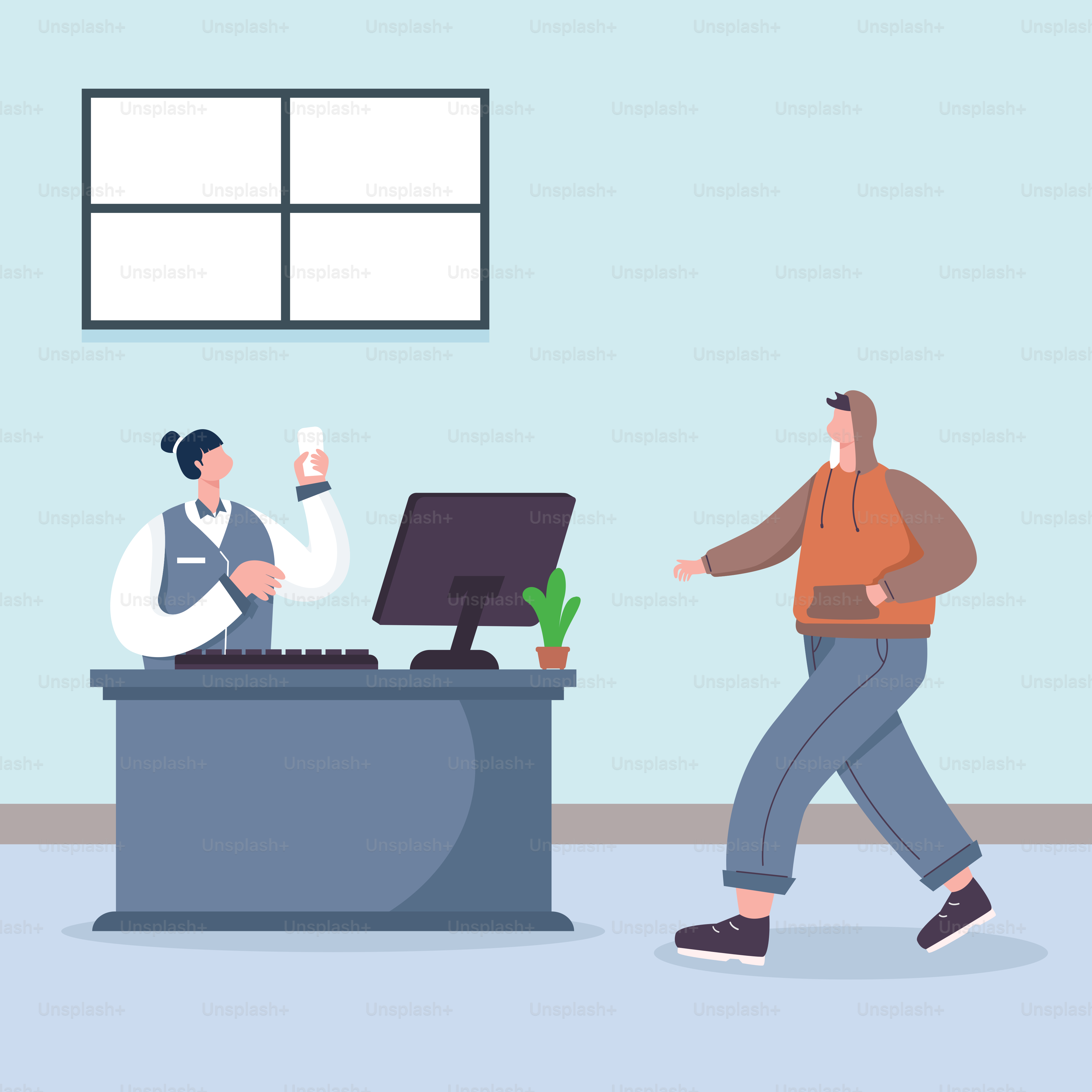 A man walking past a computer on a desk