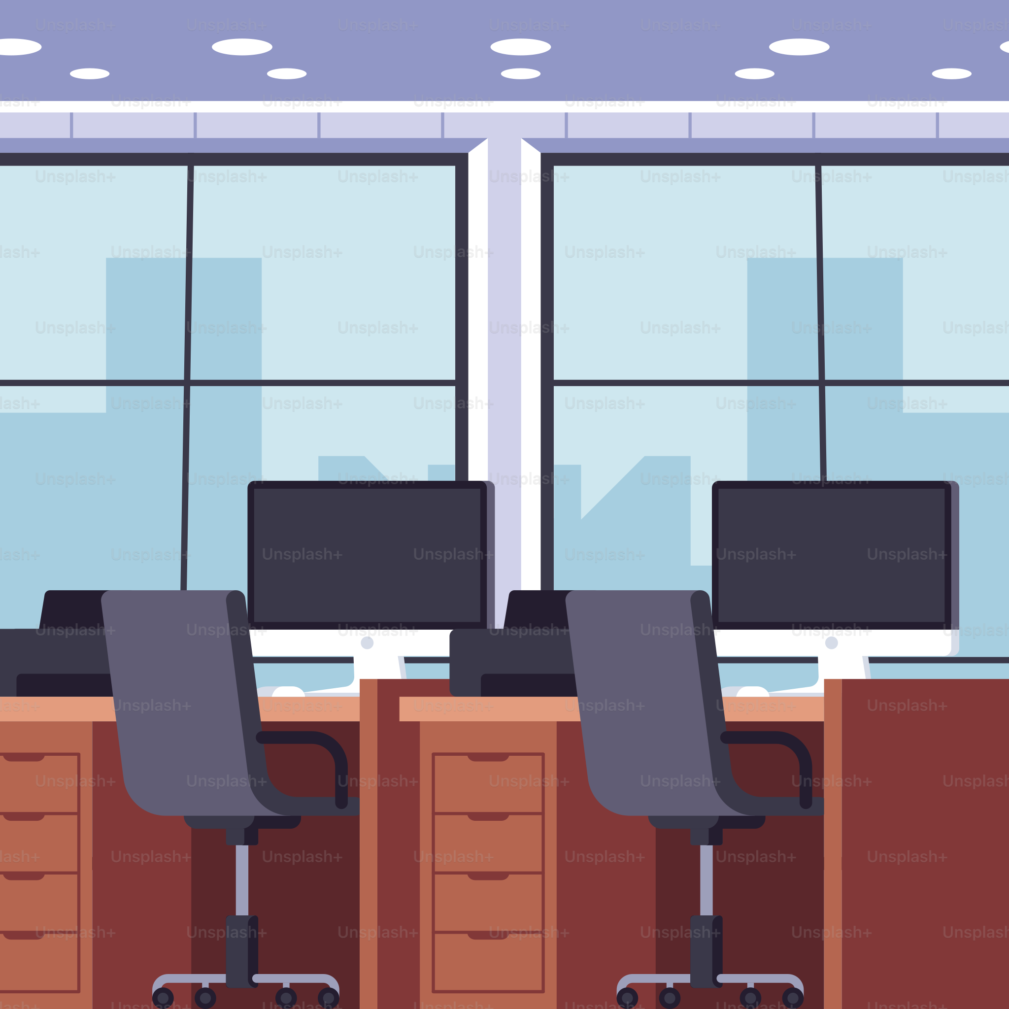 A row of computer desks sitting in front of a window