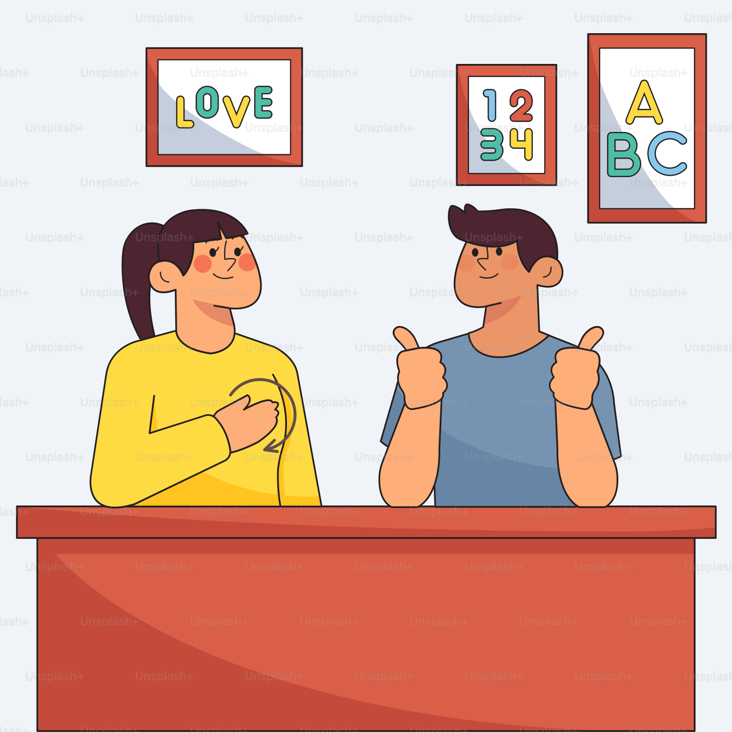 Two people sitting at a desk giving thumbs up