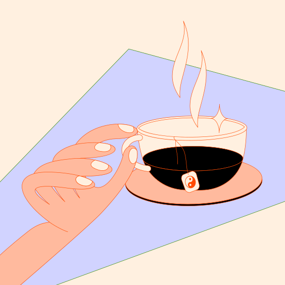 A person holding a cup of coffee on top of a table