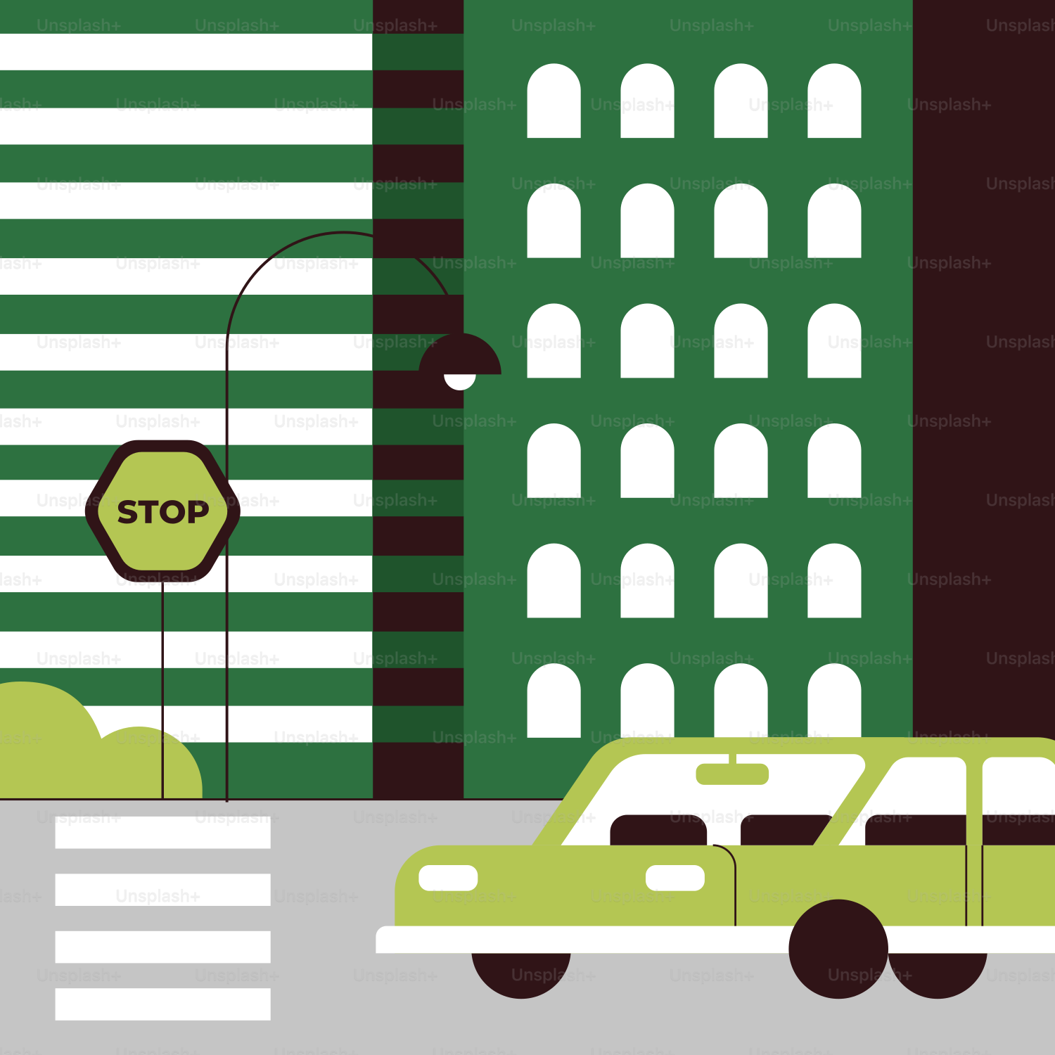 A green car driving down a street next to tall buildings