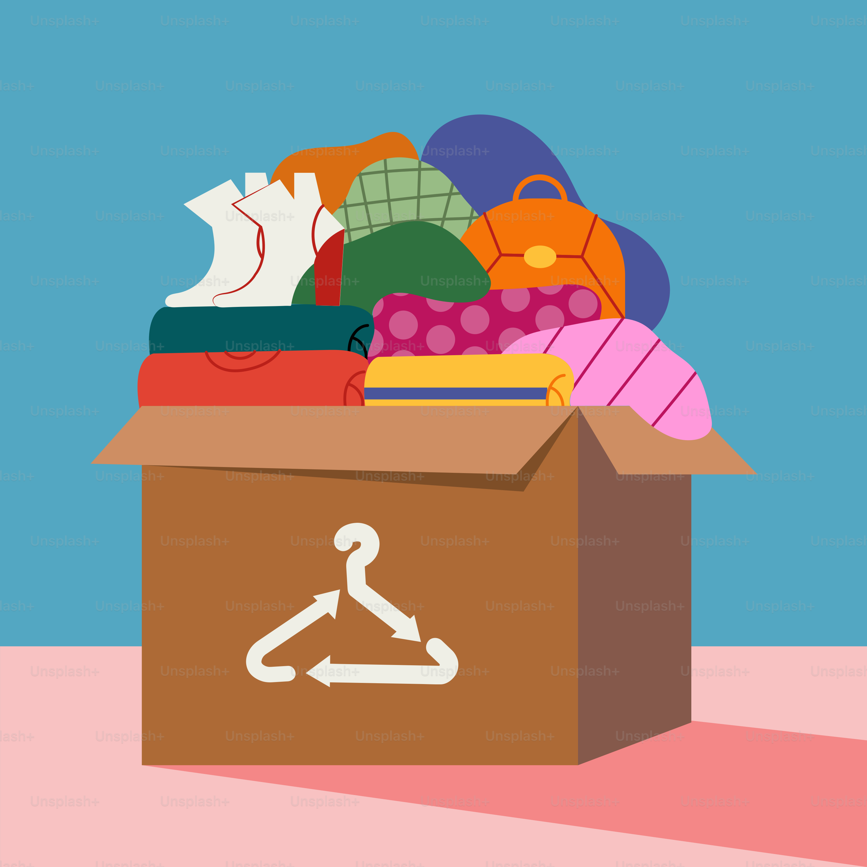 A cardboard box filled with clothes and shoes