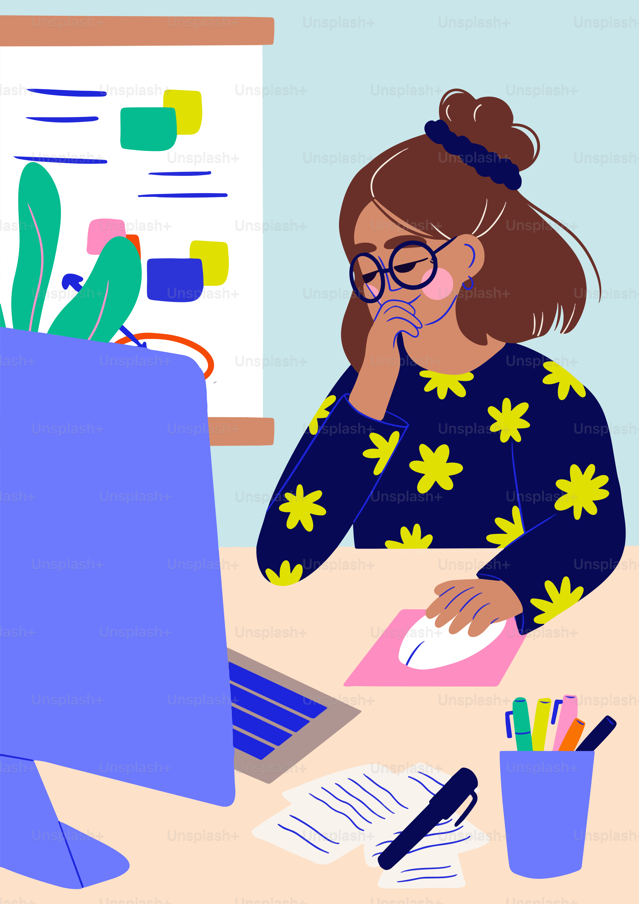 A woman sitting at a desk in front of a computer