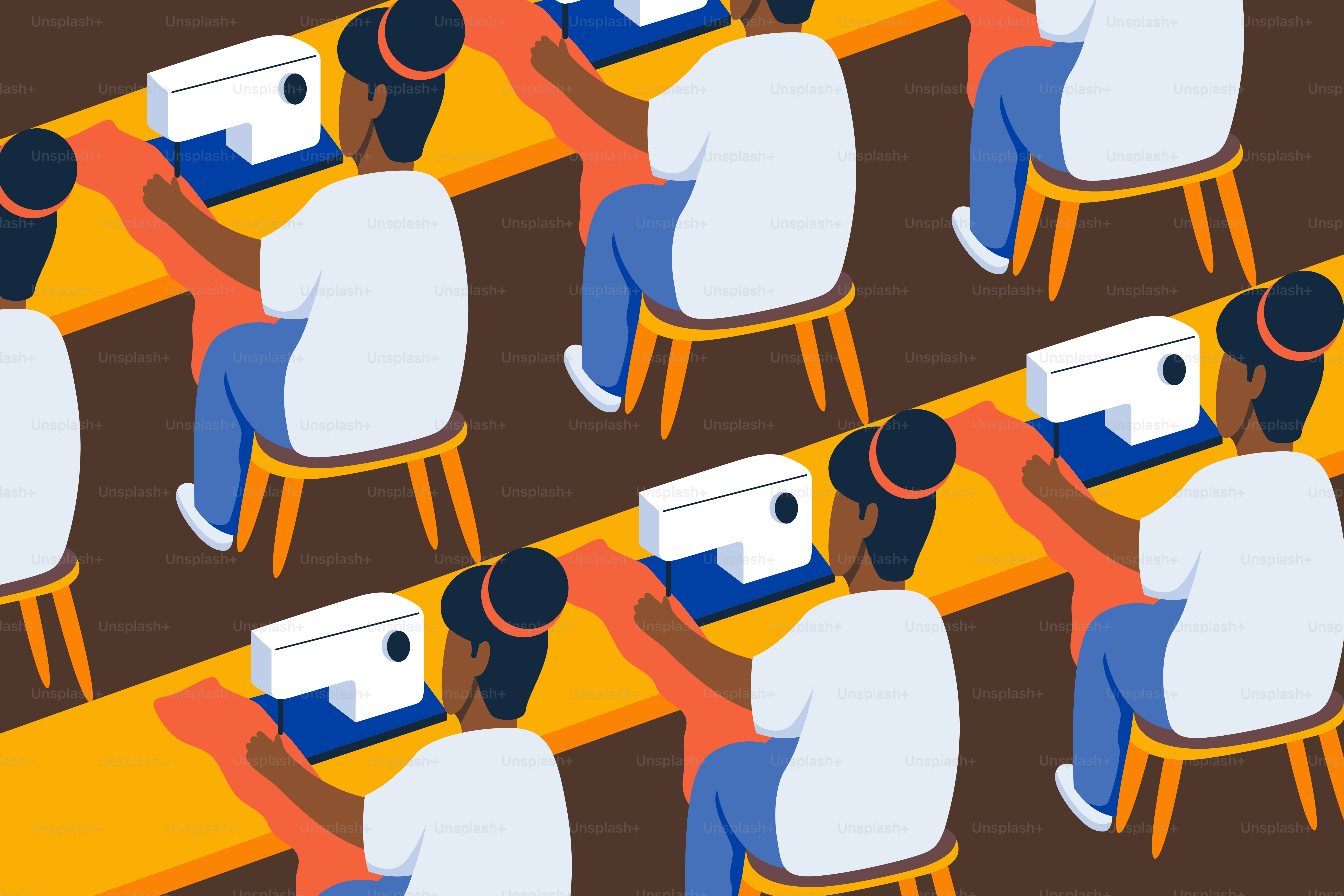 A group of people sitting at desks with laptops