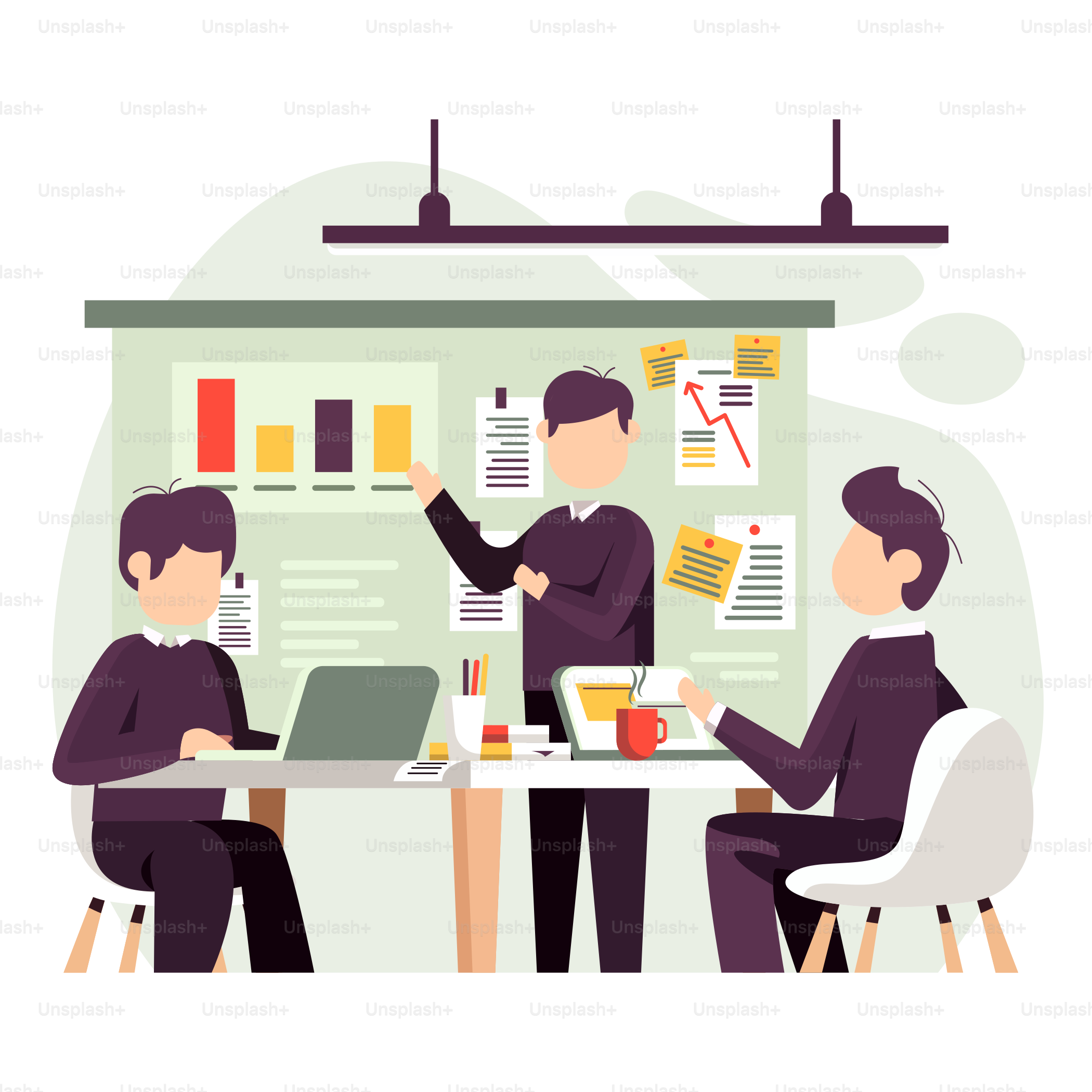 A group of people sitting at a table with laptops