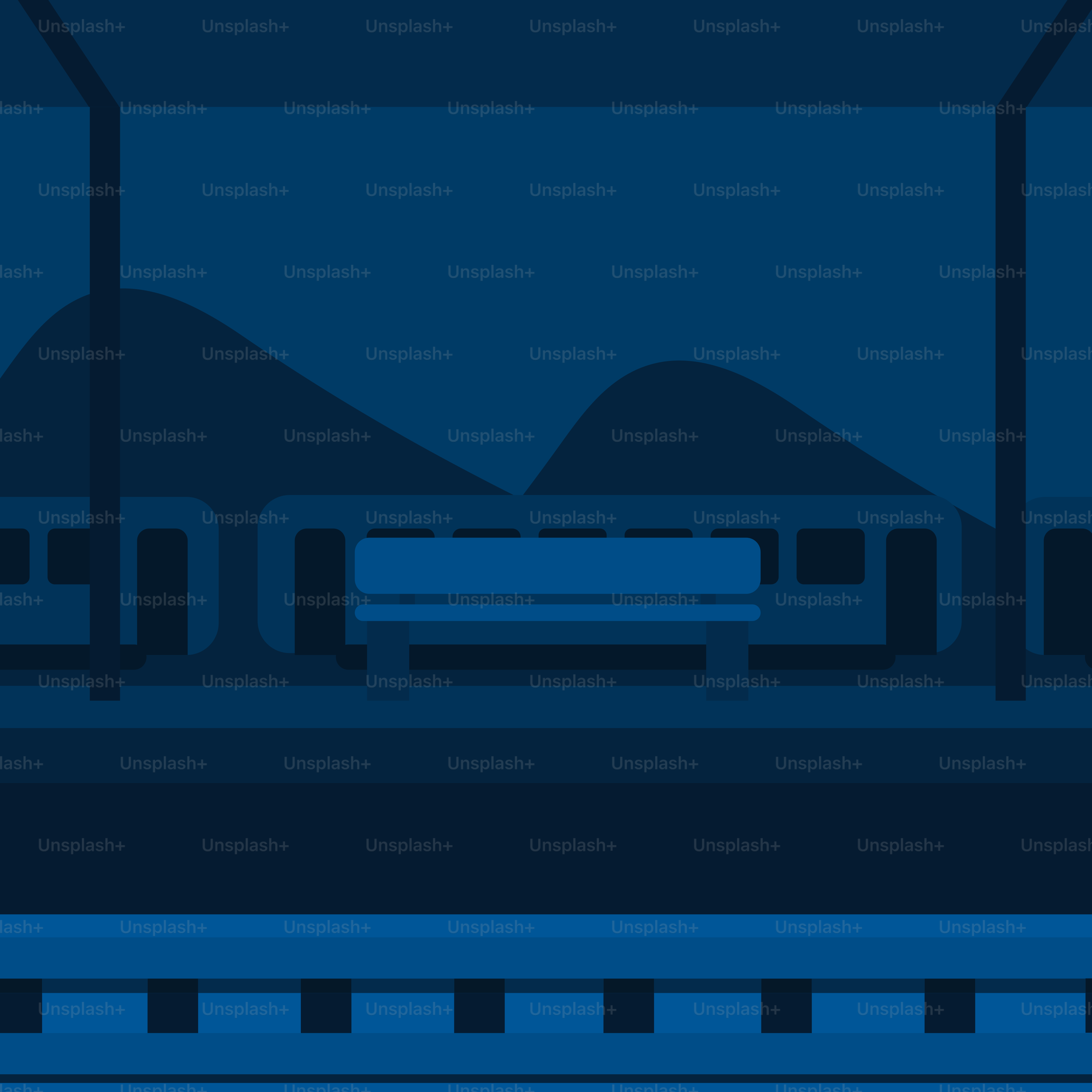 A train traveling through a train station at night