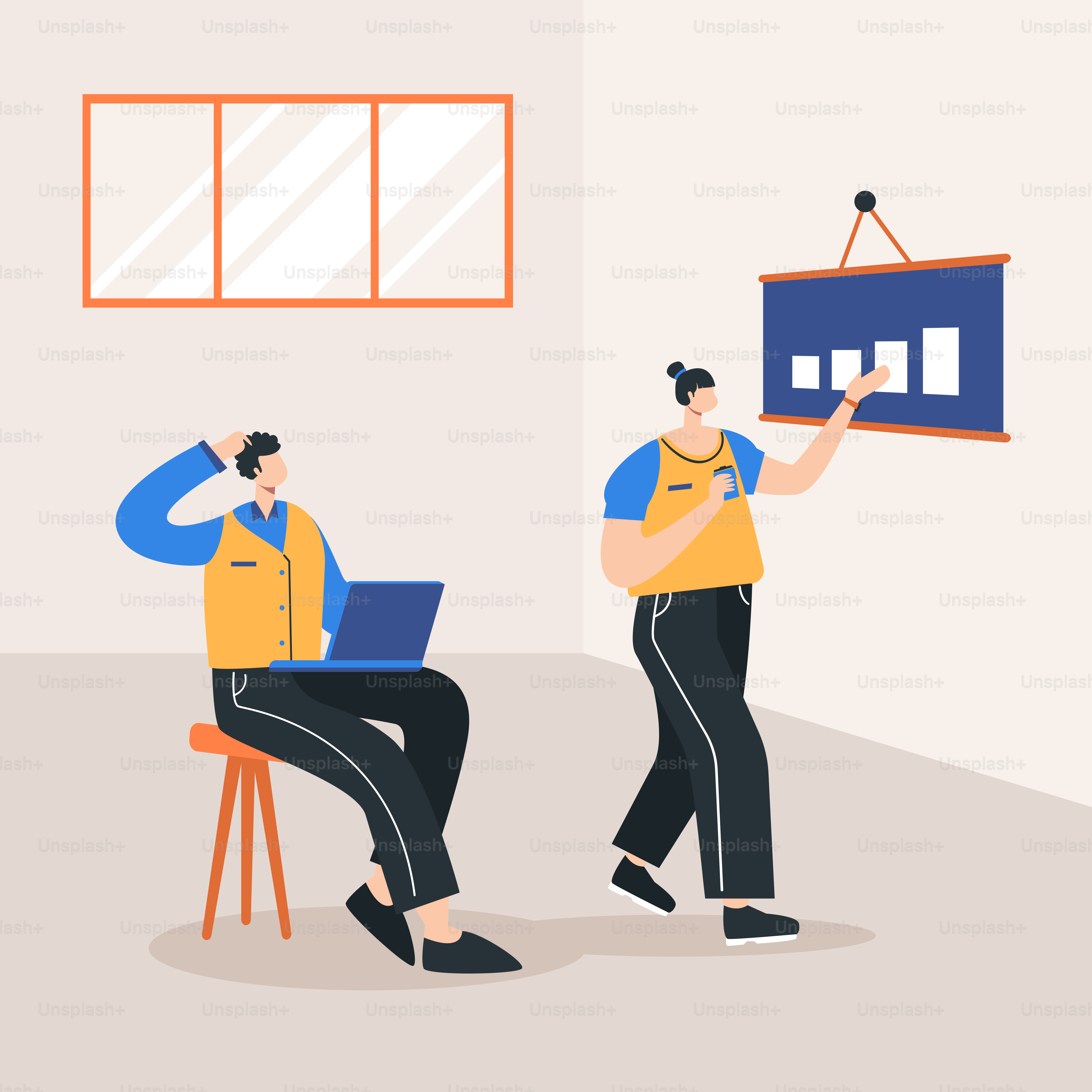 Two people sitting in a room with a laptop