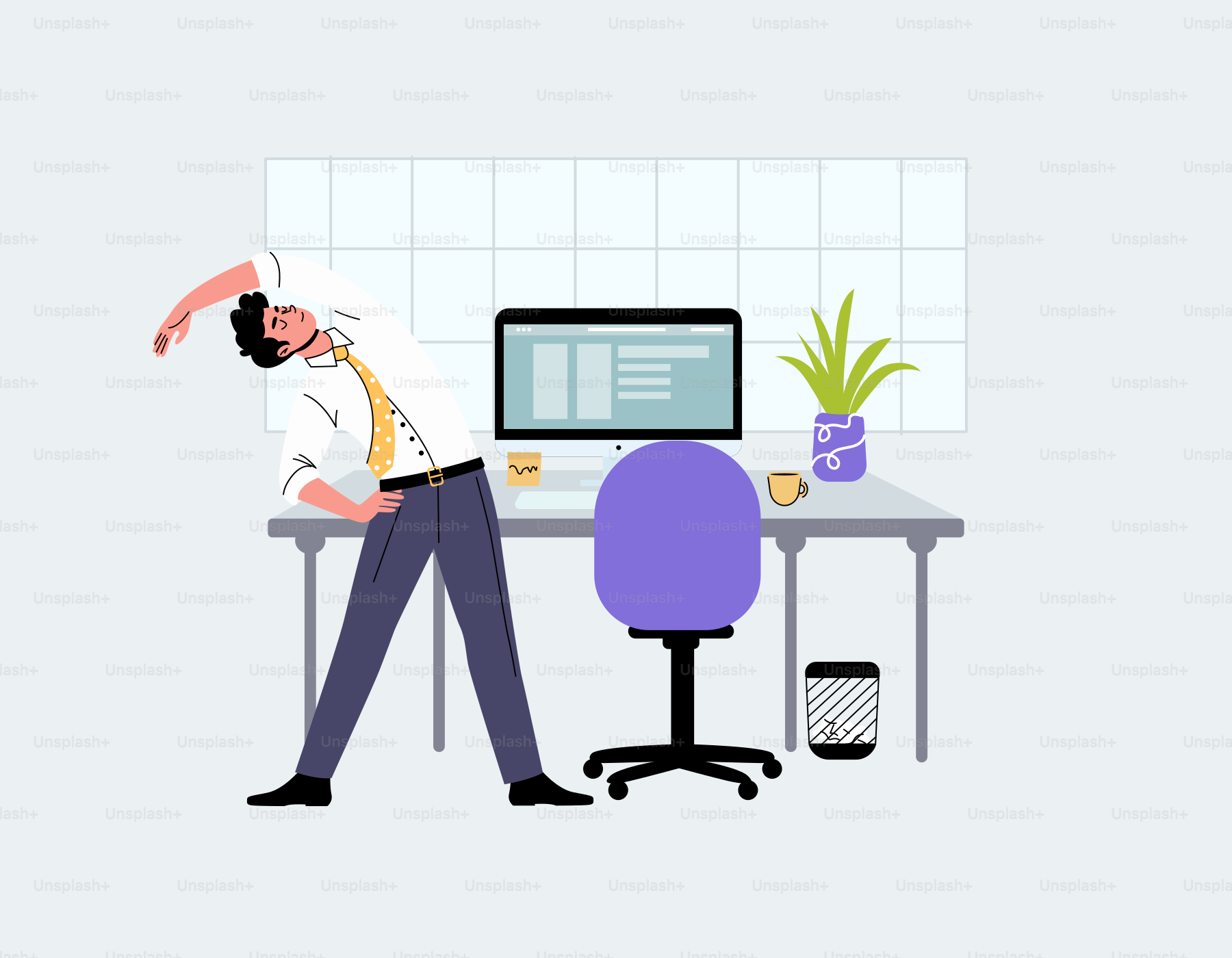 A man sitting at a desk in front of a computer