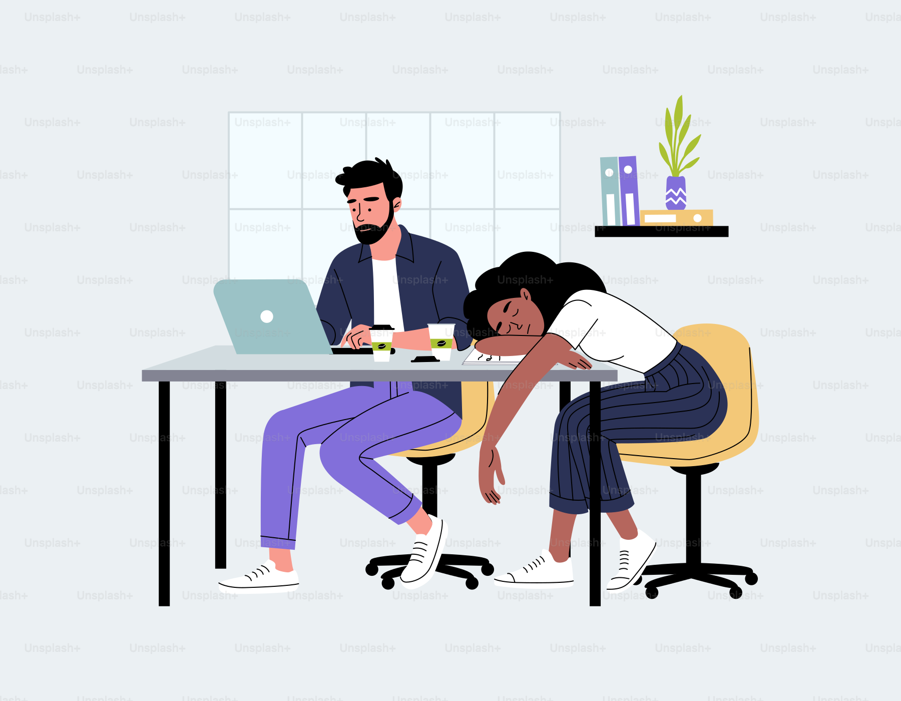 A man and woman sitting at a table with a laptop