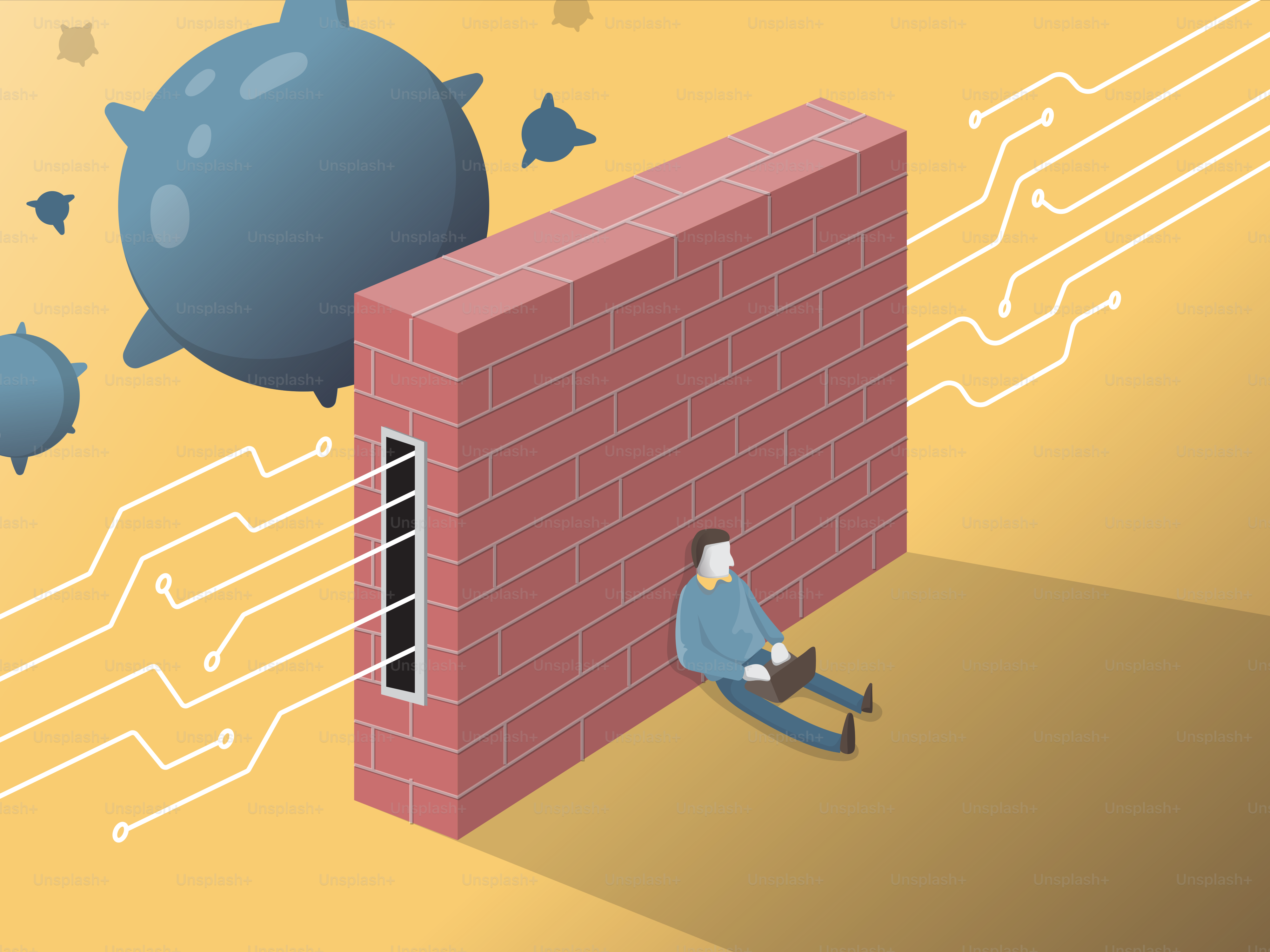 A man sitting on the ground next to a brick wall