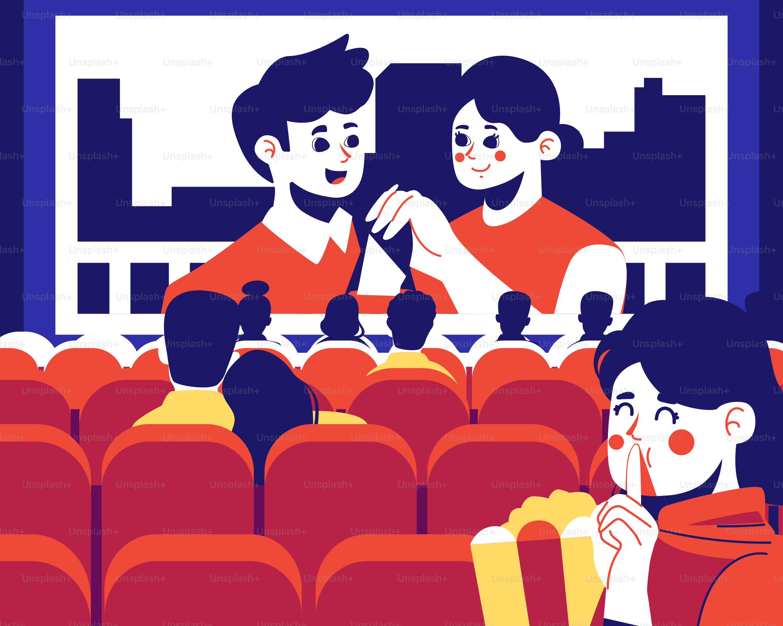 A couple of people sitting in a movie theater