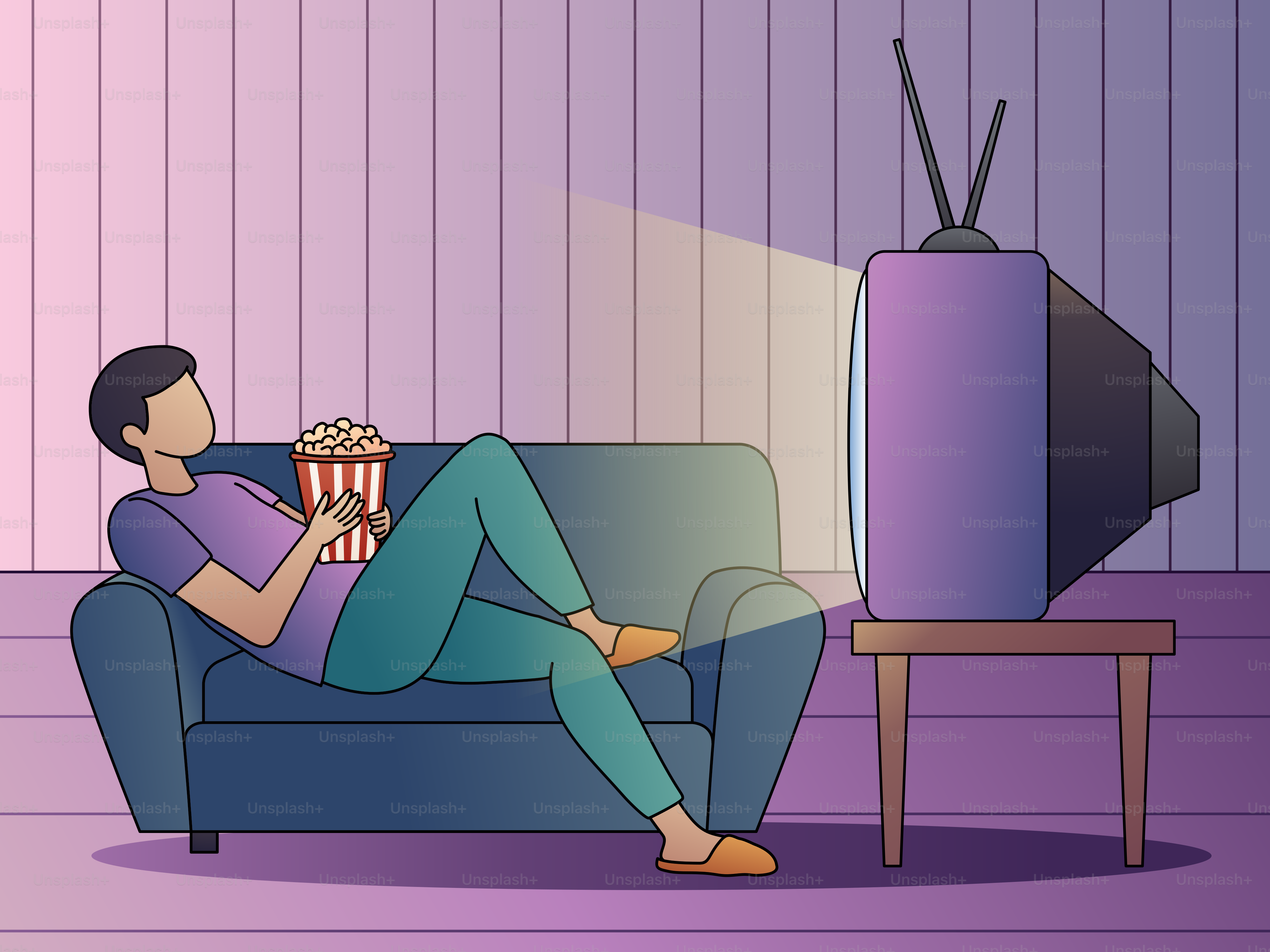 A man sitting on a couch watching TV